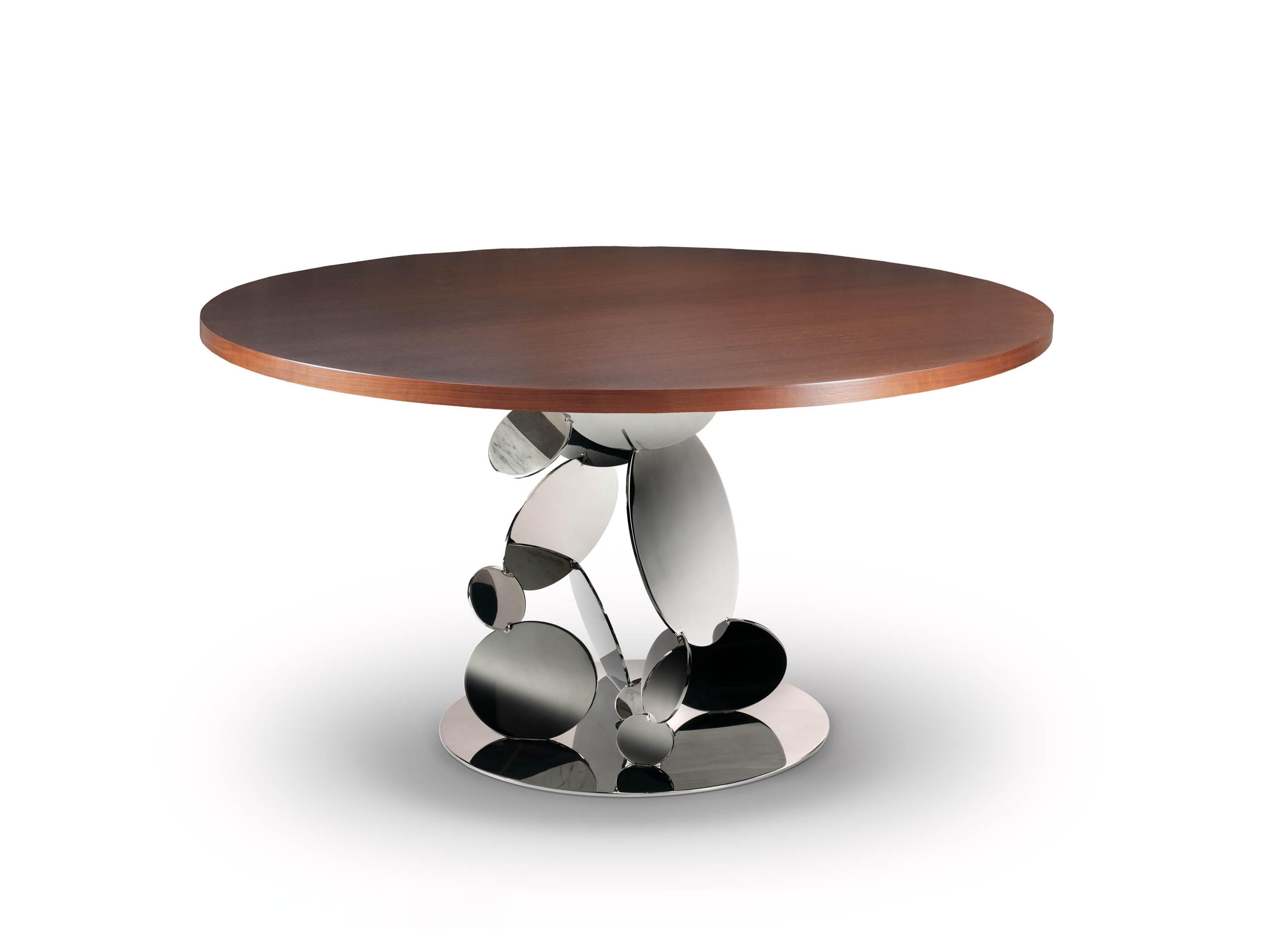 Extraordinary dining round table with a structure that is made up of multiple stainless steel disks welded one by one to each other to create a rigid structure. In addition to being hand welded, the whole structure is also finely hand polished in
