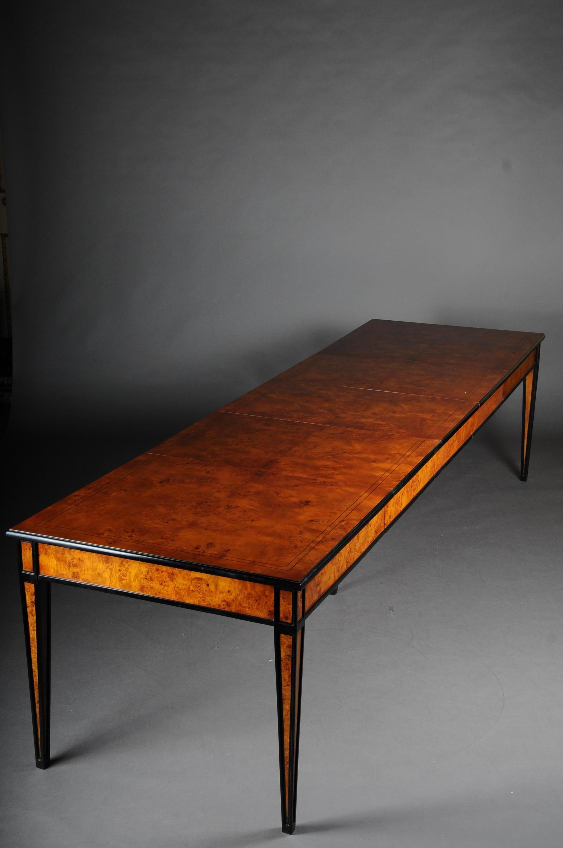 Beautiful dining table / conference table, extendable in Biedermeier style
 
Bird's-eye maple on solid wood. Straight frame base on five high conical square legs, partially ebonized. Slightly protruding, profiled table top also ebonised and double