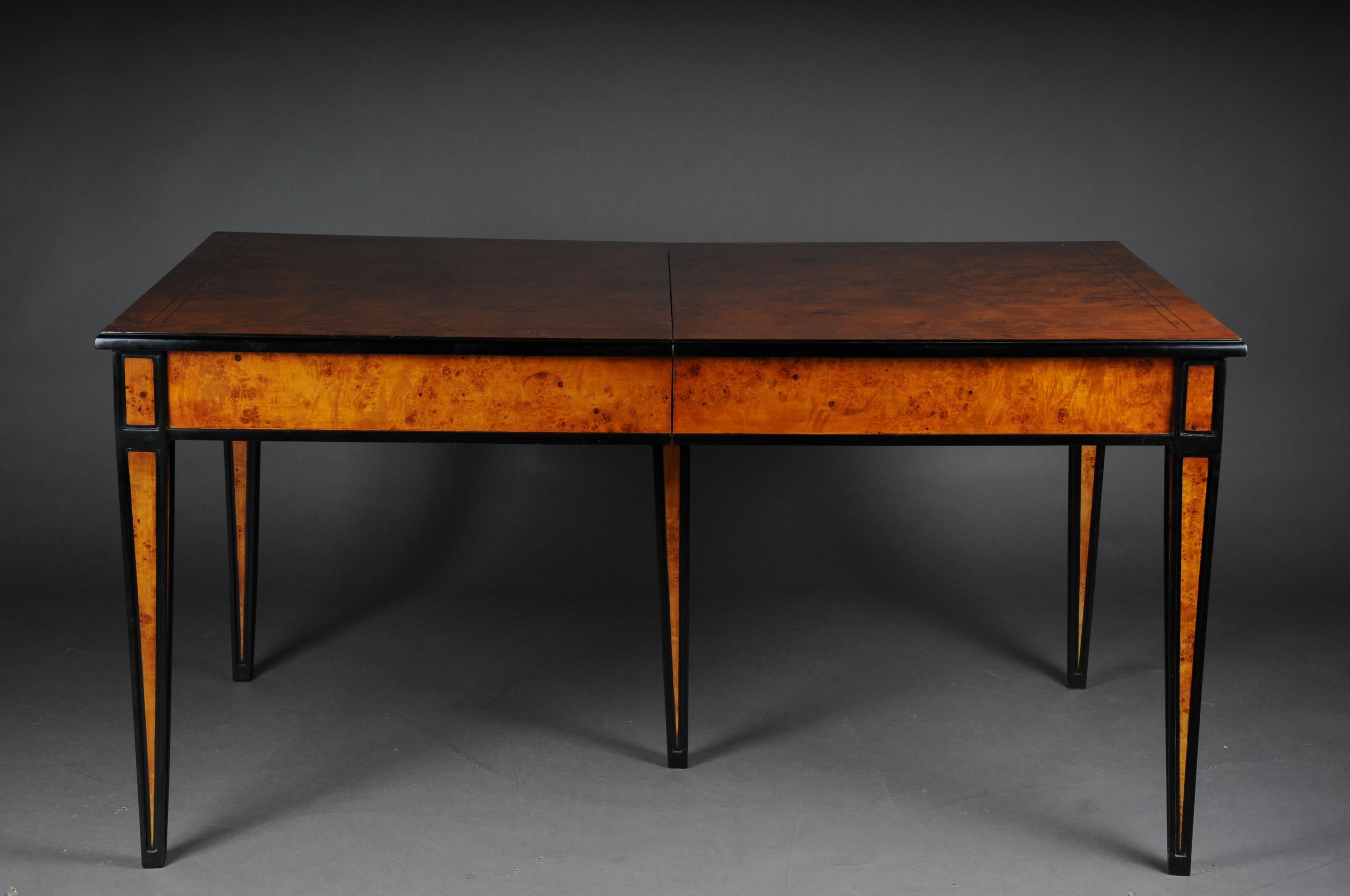 Beautiful dining table / conference table, extendable in Biedermeier style
 
Bird's-eye maple on solid wood. Straight frame base on five high conical square legs, partially ebonized. Slightly protruding, profiled table top also ebonized and double