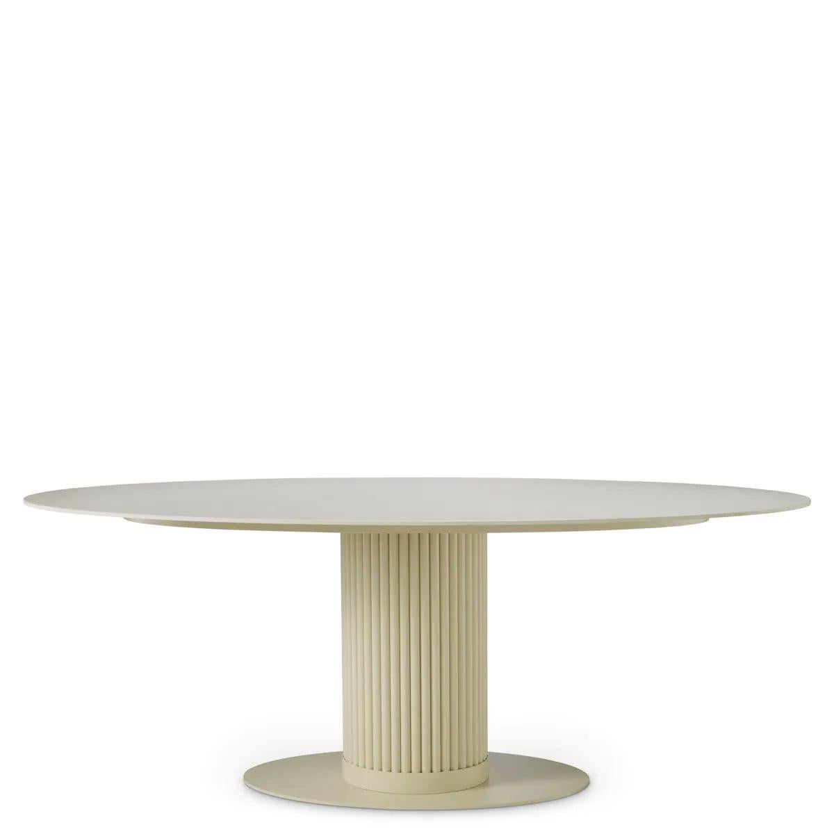 This dining table features an oval shape with a cream ceramic top and a subtle sand finish, combining natural stone elegance with durable modern engineering. The ceramic tabletop offers a smooth, resilient surface that withstands daily use while