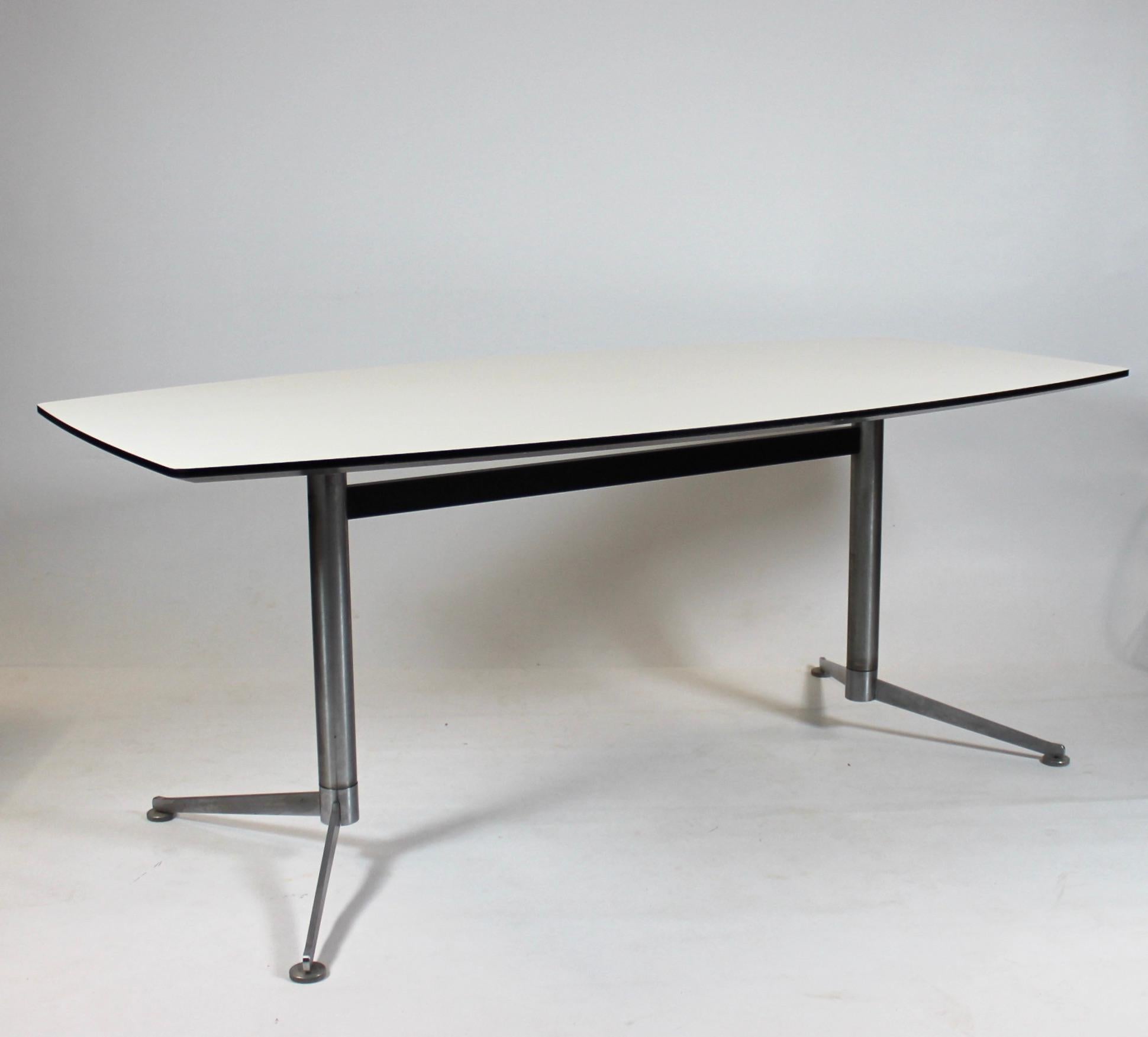 Dining table with white laminate and steel legs by Charles and Ray Eames. The table is in great condition and manufactured on the 19th of October 2005.