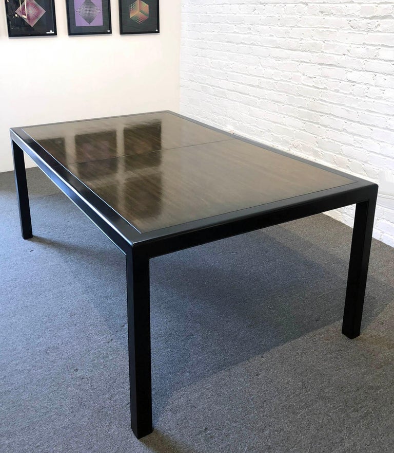 Dunbar Furniture is one of the best names in American modern furniture. Edward Wormley is the designer. Mahogany dining table The table has three leaves. Without leaves the measurement is 72