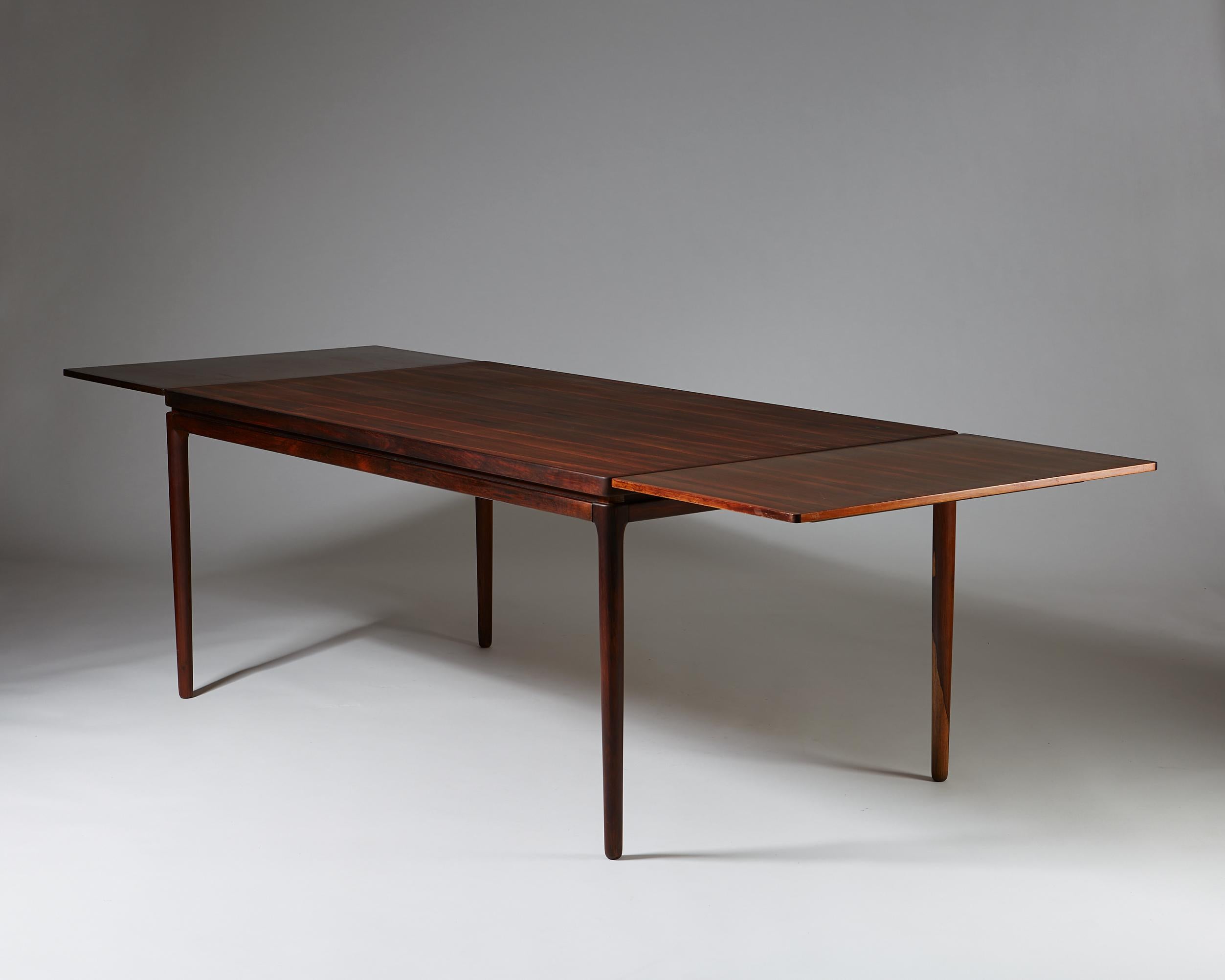Dining table designed by Johannes Andersen for Christian Linnebergs Möbelfabrik,
Denmark. 1960s.

Rosewood.

Dimensions: 
H: 72 cm / 2' 4 1/2