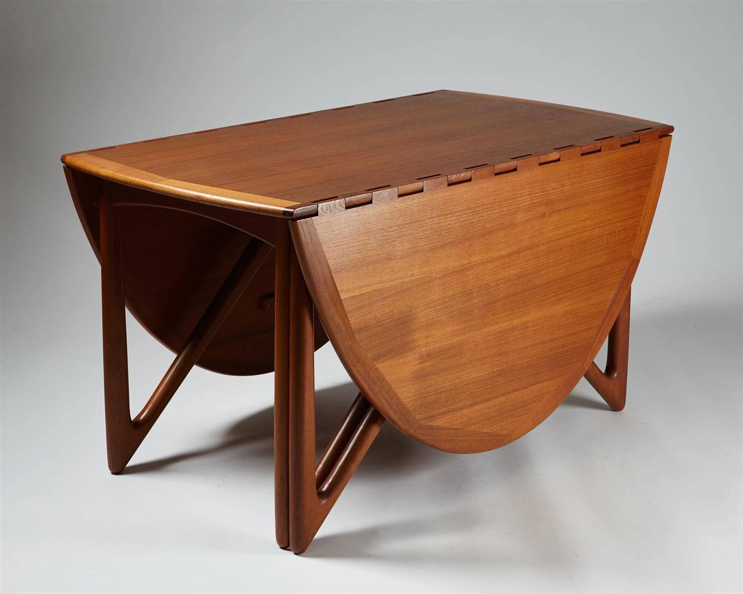 Dining table designed by Niels Koefoed,
Denmark, 1960s.

Teak.

Dimensions: 
H: 72.5 cm/ 28 3/4''
Length when extended: 196 cm/ 6' 4''
W: 130 cm/ 4' 3''
