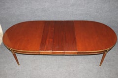 Signed Maison Jansen Brass and Bronze Adorned Mahogany Dining Table with 3 Leave