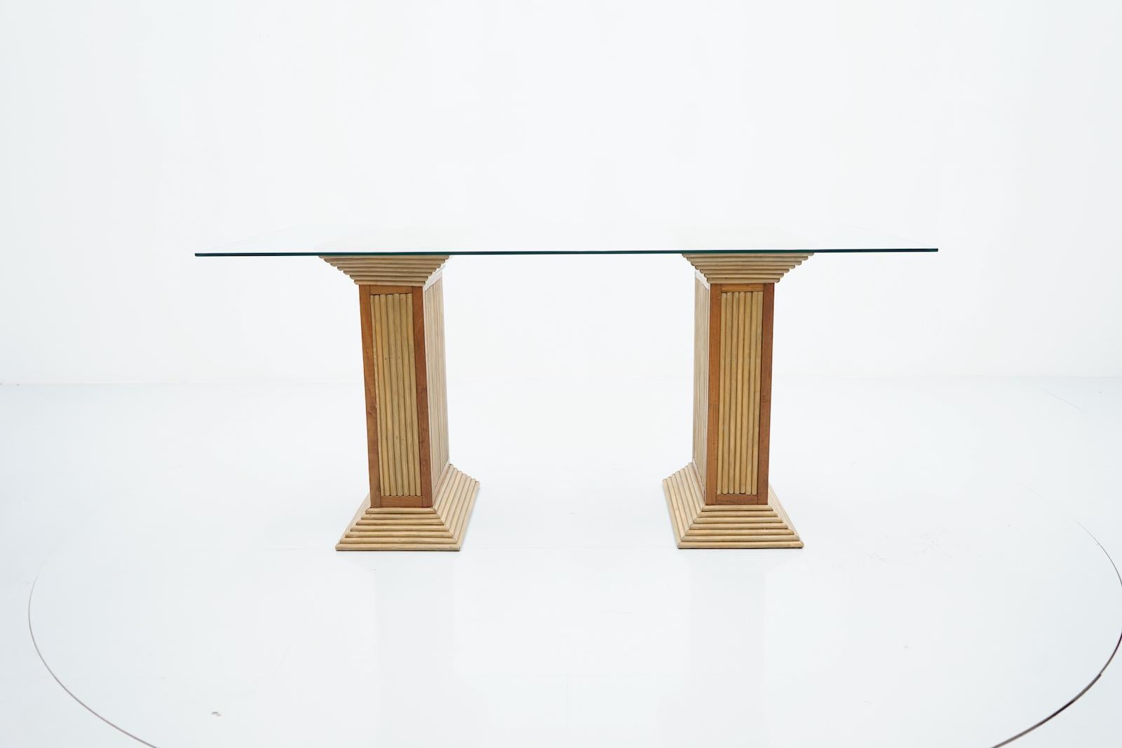 Dining Table with two columns in bamboo, wood and a glass top, France 1980s

Very good condition.


Details

Period: 1980s
Color: brown
Style: Mid-Century Modern
Place of Origin: France
Dimensions: Height:73 cm, Depth 90 cm, Width 150 cm
Condition: