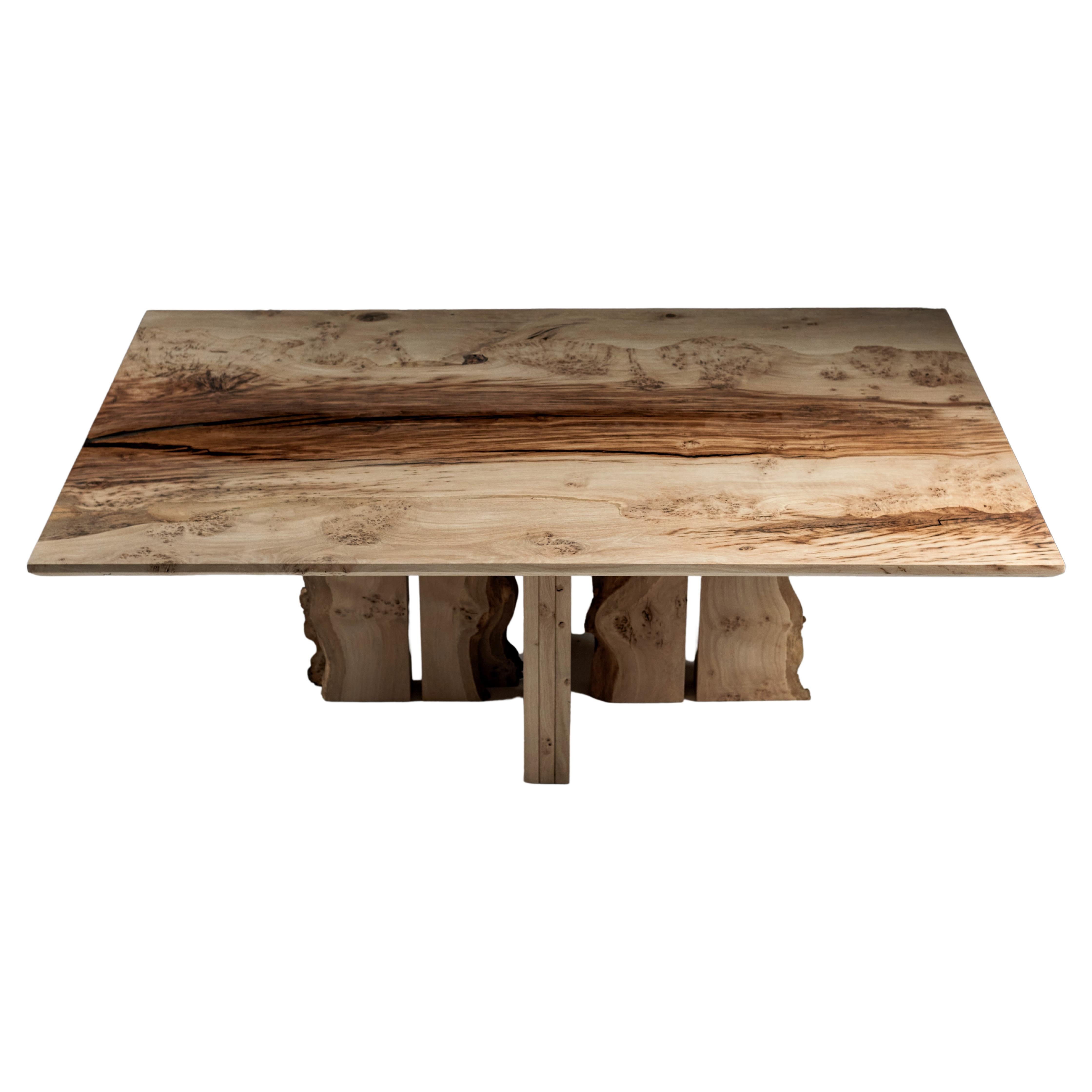 Dining Table of solid English Oak, made from two slabs of book-matched timber joined in the centre.
The Kiln dried oak has drying splits that feature a clear resin with a tint of ebony.
The central leg arrangement allows for seating in any position