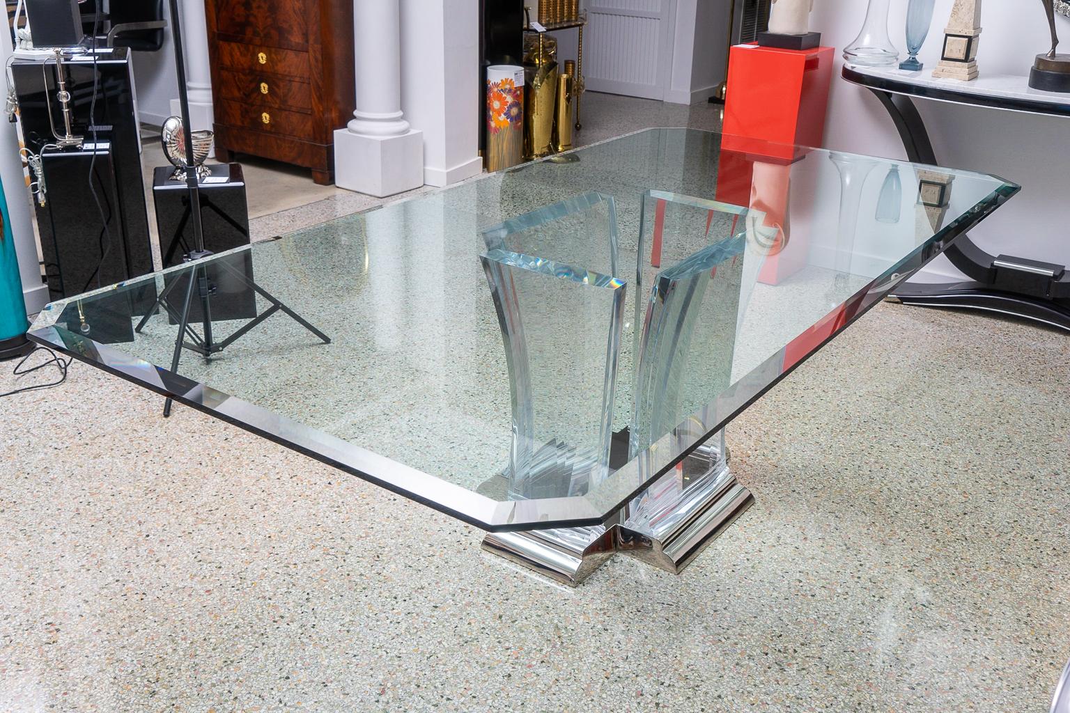 This large scale dining table by Jeffrey Bigelow has been professionally restored as of June, 2019. The base has been nickel-plated and lacquered and the Lucite supports have been polished. 

Note: Glass is 1