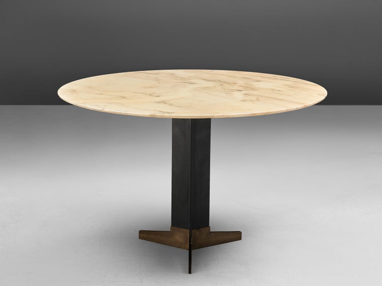 Attributed to Ignazio Gardella, dining table, marble, brass, metal, Italy, circa 1958

A circular pedestal table with a refined black lacquered metal. The base in combination with the tripod foot in brass is characteristic for the geometric work