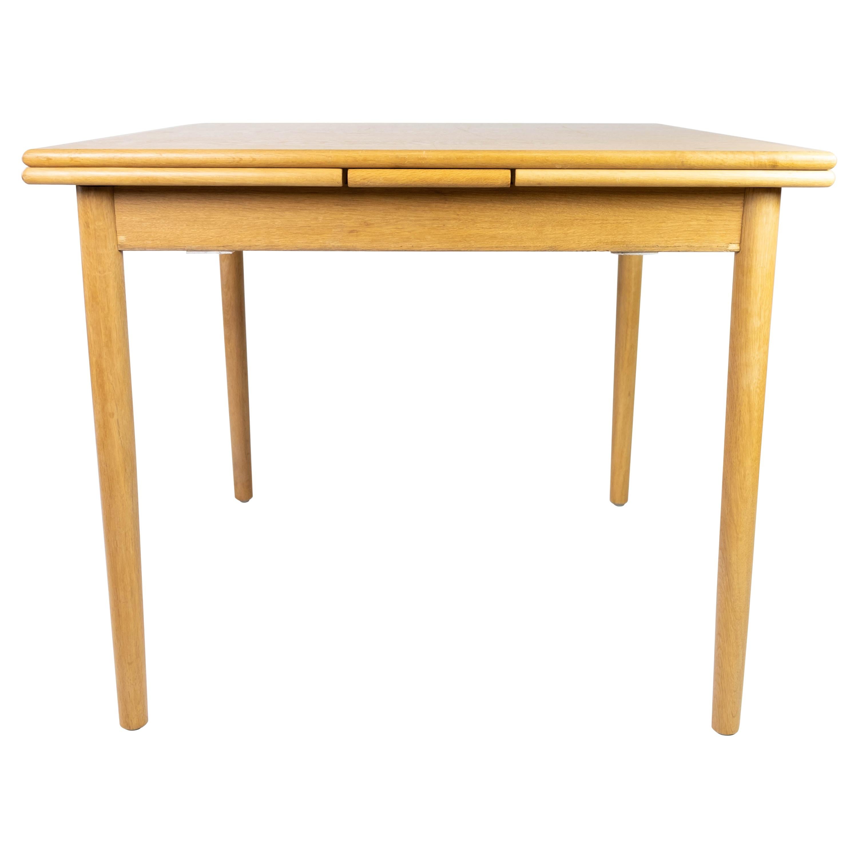 Dining Table in Oak with Extensions, of Danish Design from the 1960s