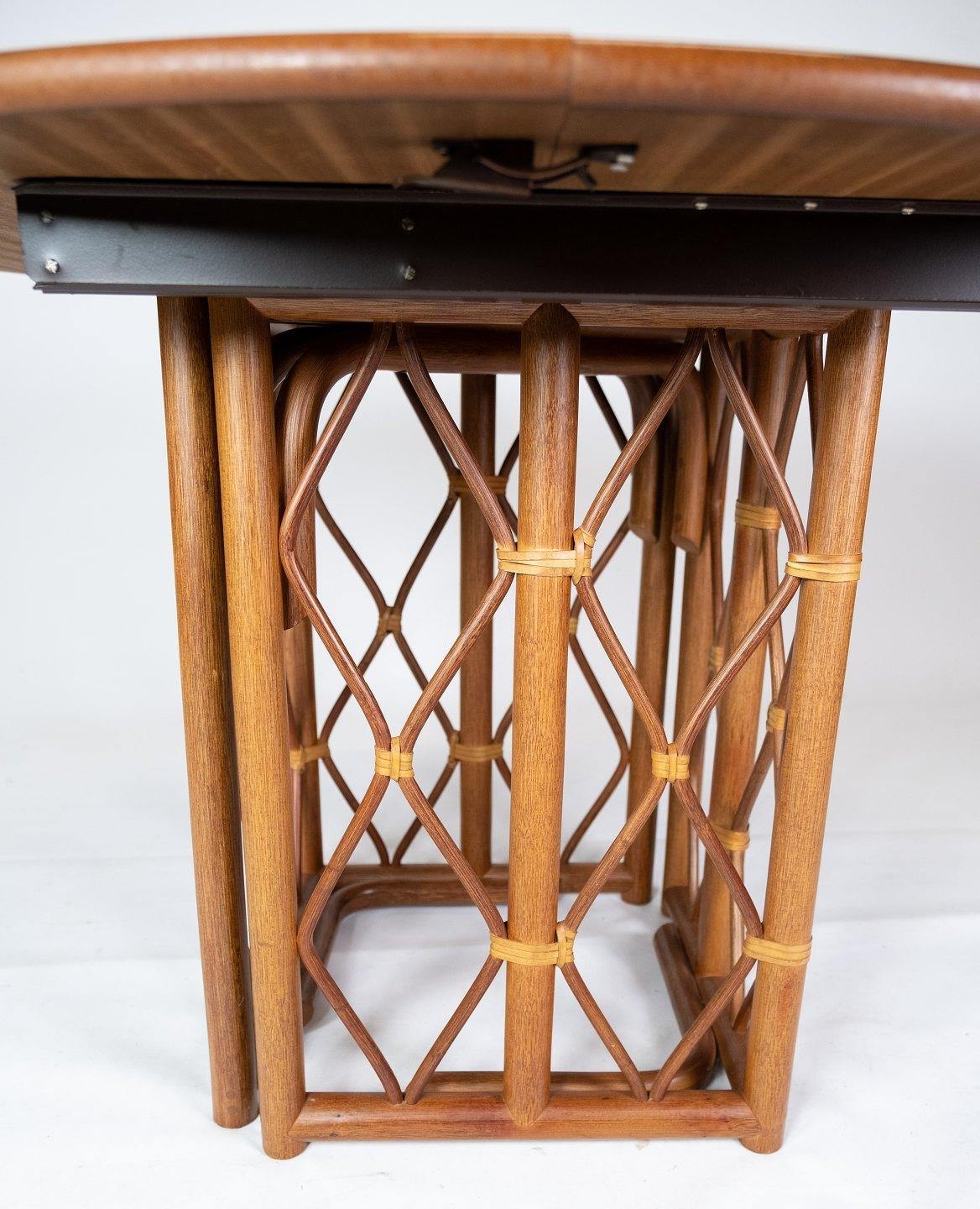 This oak dining table, a prime example of Danish design from the 1960s, embodies both functionality and elegance. Its sturdy construction ensures durability while maintaining a timeless aesthetic.

Featuring two extensions, this table offers