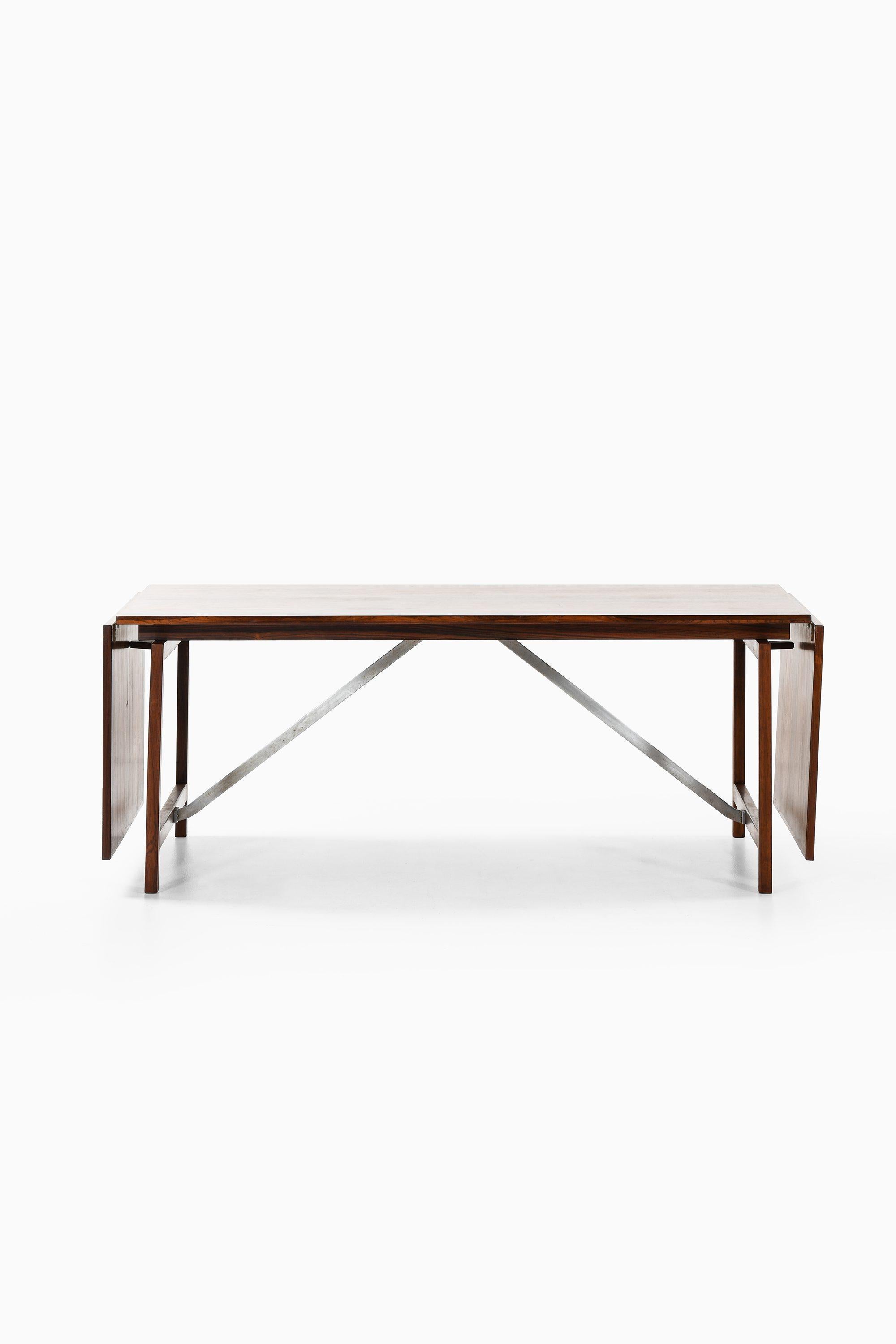 Scandinavian Modern Dining Table in Rosewood and Steel by Hans Wegner, 1960s For Sale