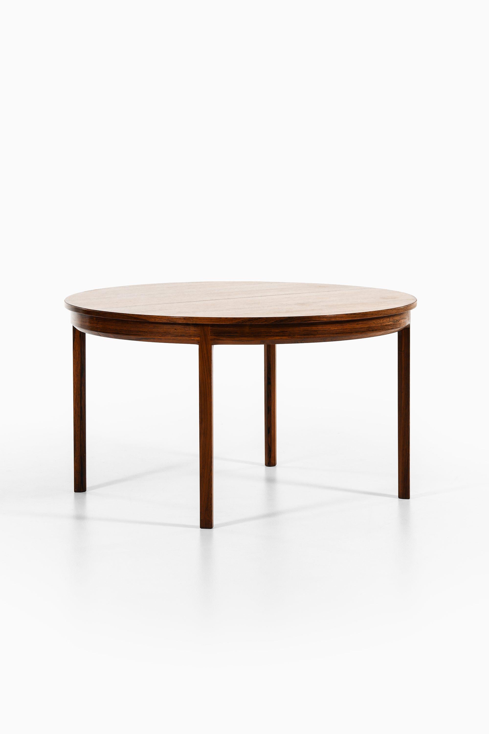 Dining Table in Rosewood by Bernt Petersen, 1960's

Additional Information:
Material: Rosewood
Style: Mid century, Scandinavian
Produced by Holger Nissen in Denmark
Dimensions (W x D x H): 130 310 x 130 x 72.5 cm
Condition: Good vintage condition,