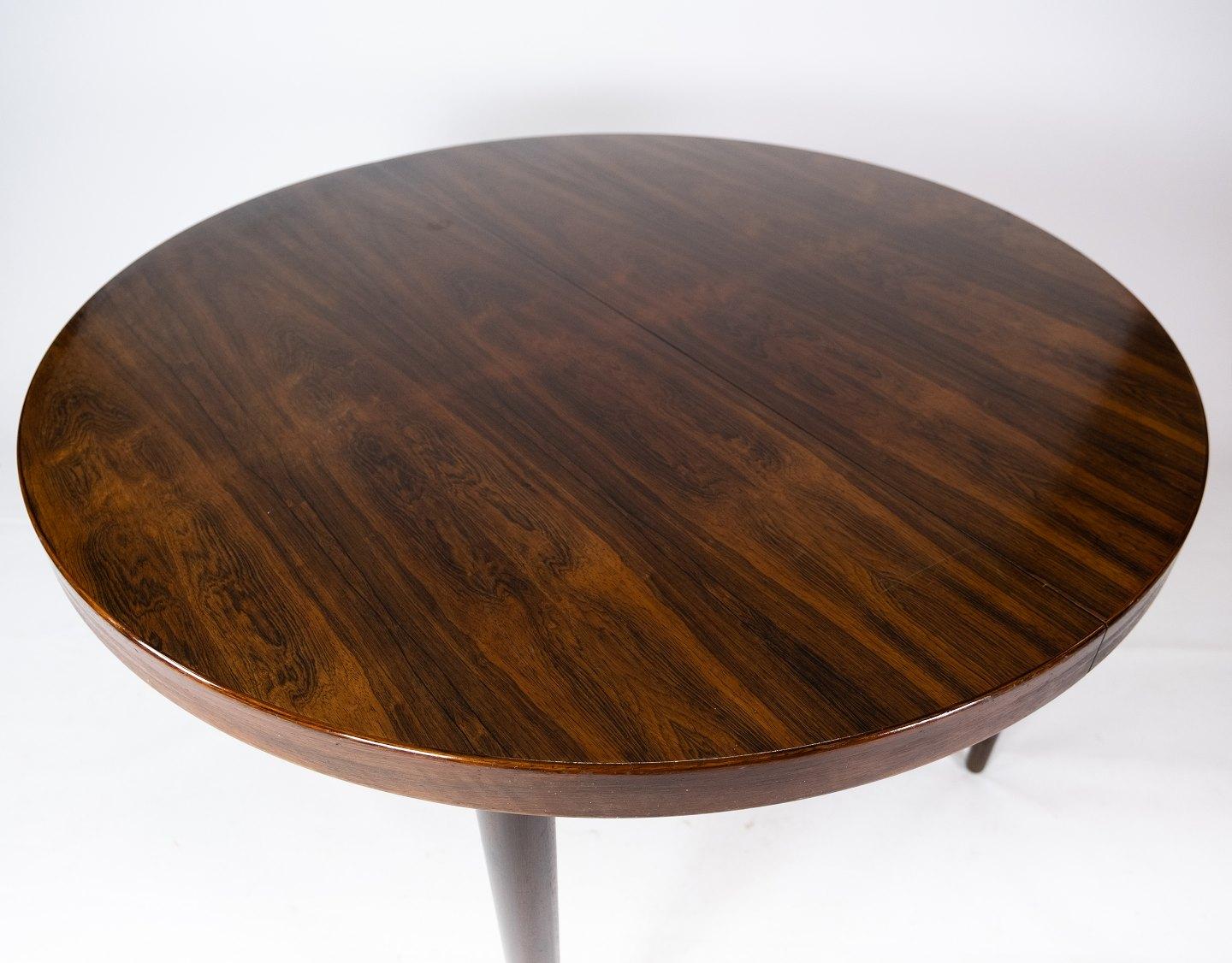 This rosewood dining table was designed by Oman Junior and dates from the 1960s. The table is a brilliant example of Danish furniture design from that time, with its beautiful wood and elegantly designed details.

The rich color and distinctive
