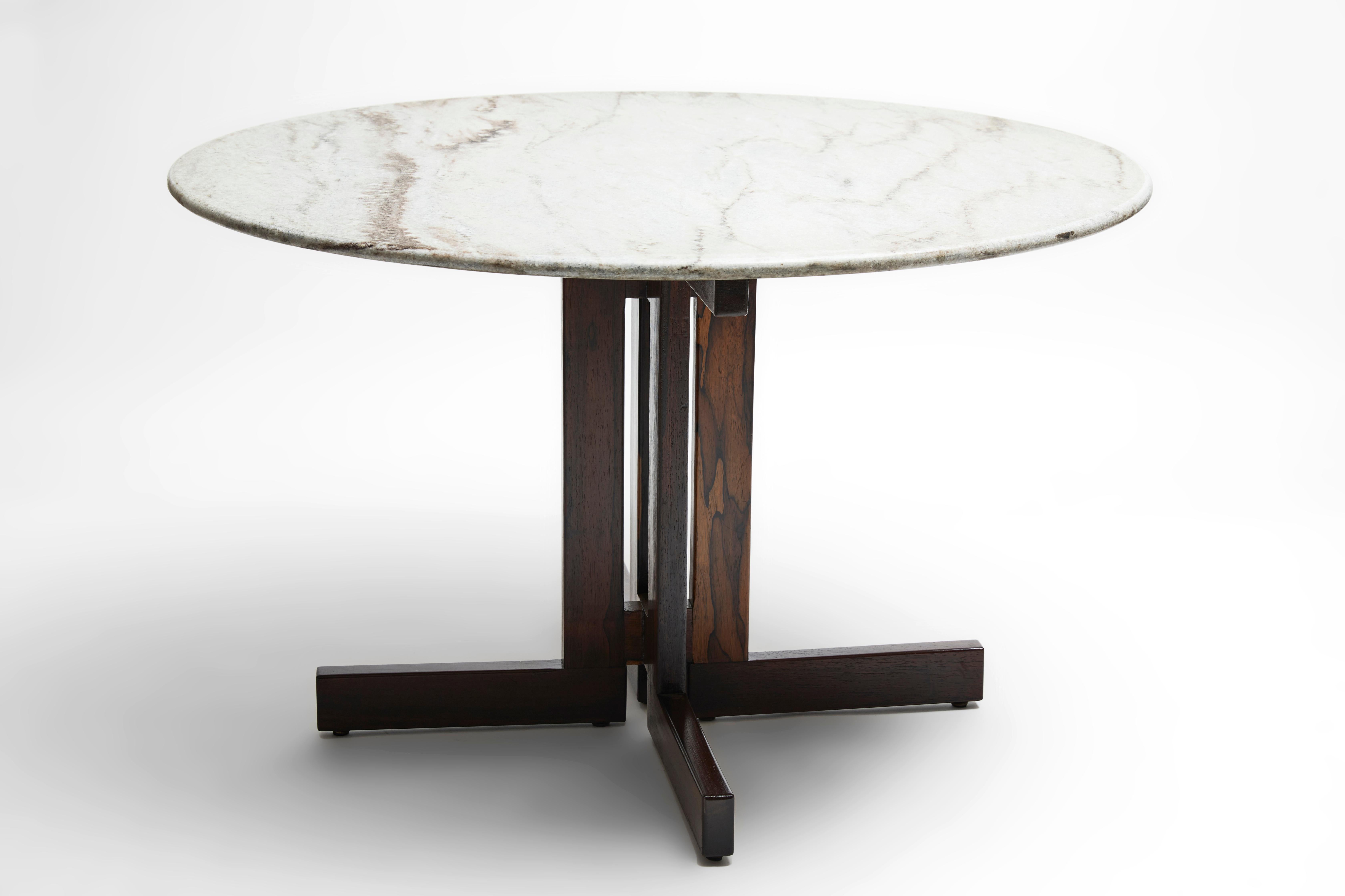 Available now, this Mid-Century Modern round table in hardwood & marble designed by Celina in Brazil in the sixties is gorgeous!

This Brazilian Modern beauty is executed in Brazilian Rosewood (as known as Jacaranda) with a 