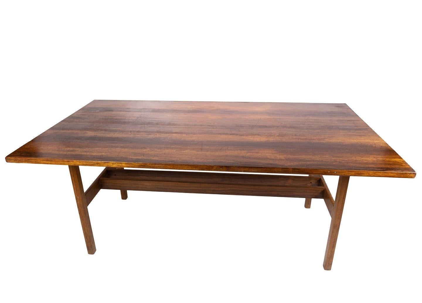 The dining table crafted in luxurious rosewood epitomizes the elegance and sophistication of Danish design during the 1960s.

Characterized by clean lines, organic shapes, and exquisite craftsmanship, Danish design from this era is celebrated for