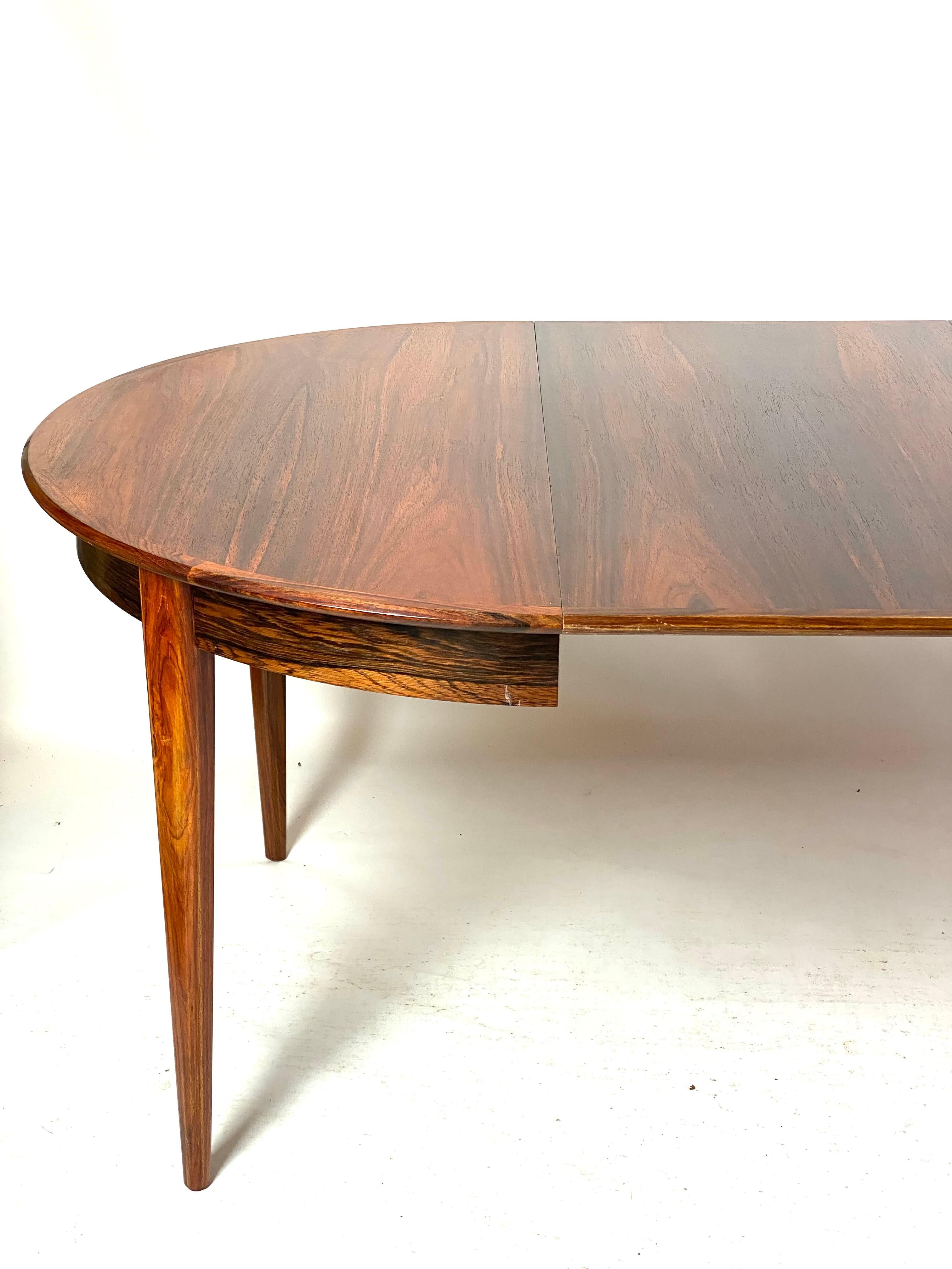 The rosewood dining table, created by Danish design from the 1960s, is an iconic piece of furniture that encapsulates the era's elegant and modern aesthetics.

The rosewood gives the table a warm and deep color, while its natural veins and patterns
