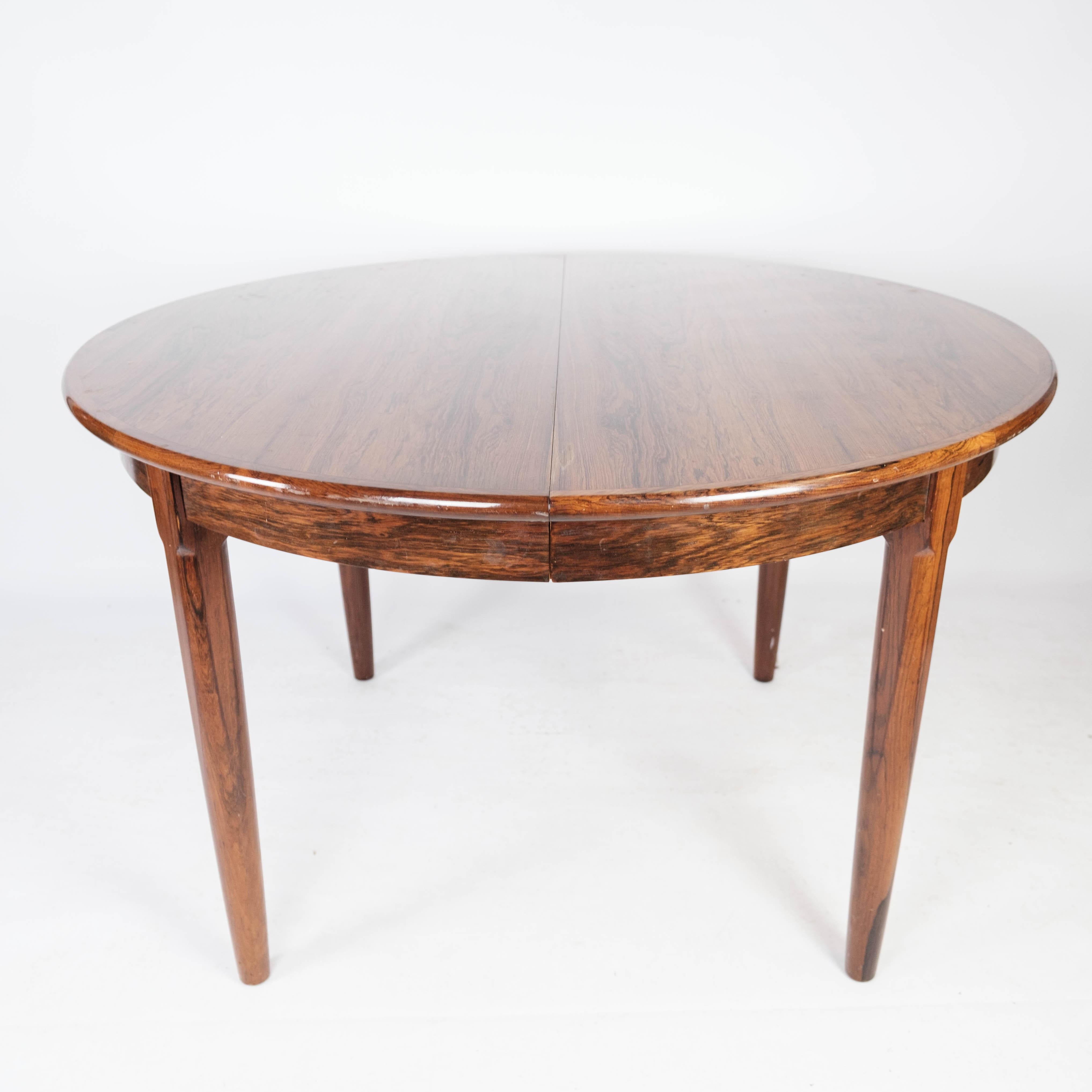 
This Danish-designed dining table from the 1960s, crafted from rosewood, epitomizes the era's fusion of elegant design and practicality.

With its rich tones and luxurious grain, the rosewood exudes a sense of warmth and sophistication, adding a