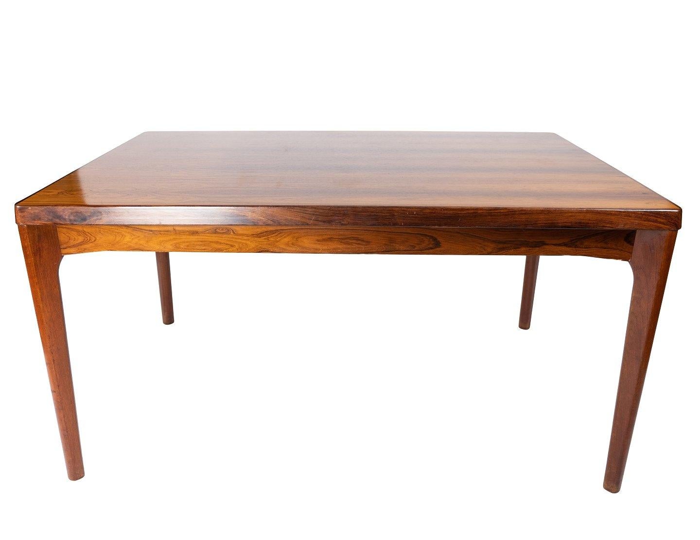Scandinavian Modern Dining Table in Rosewood with Extensions Designed by Henning Kjærnulf, 1960s