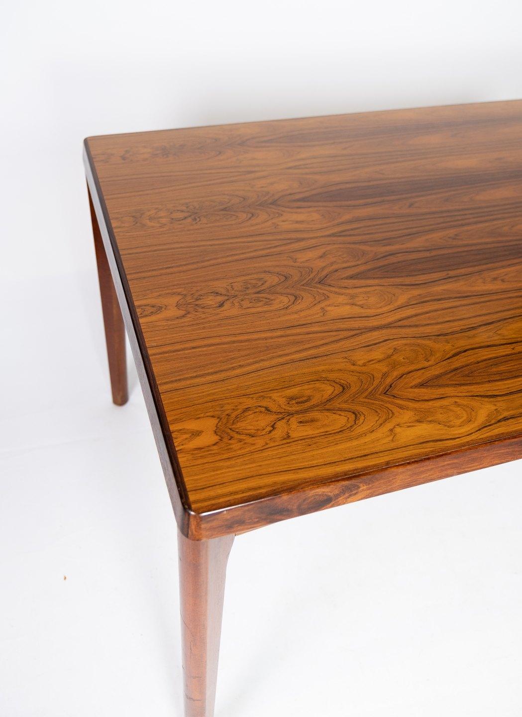 Danish Dining Table in Rosewood with Extensions Designed by Henning Kjærnulf, 1960s
