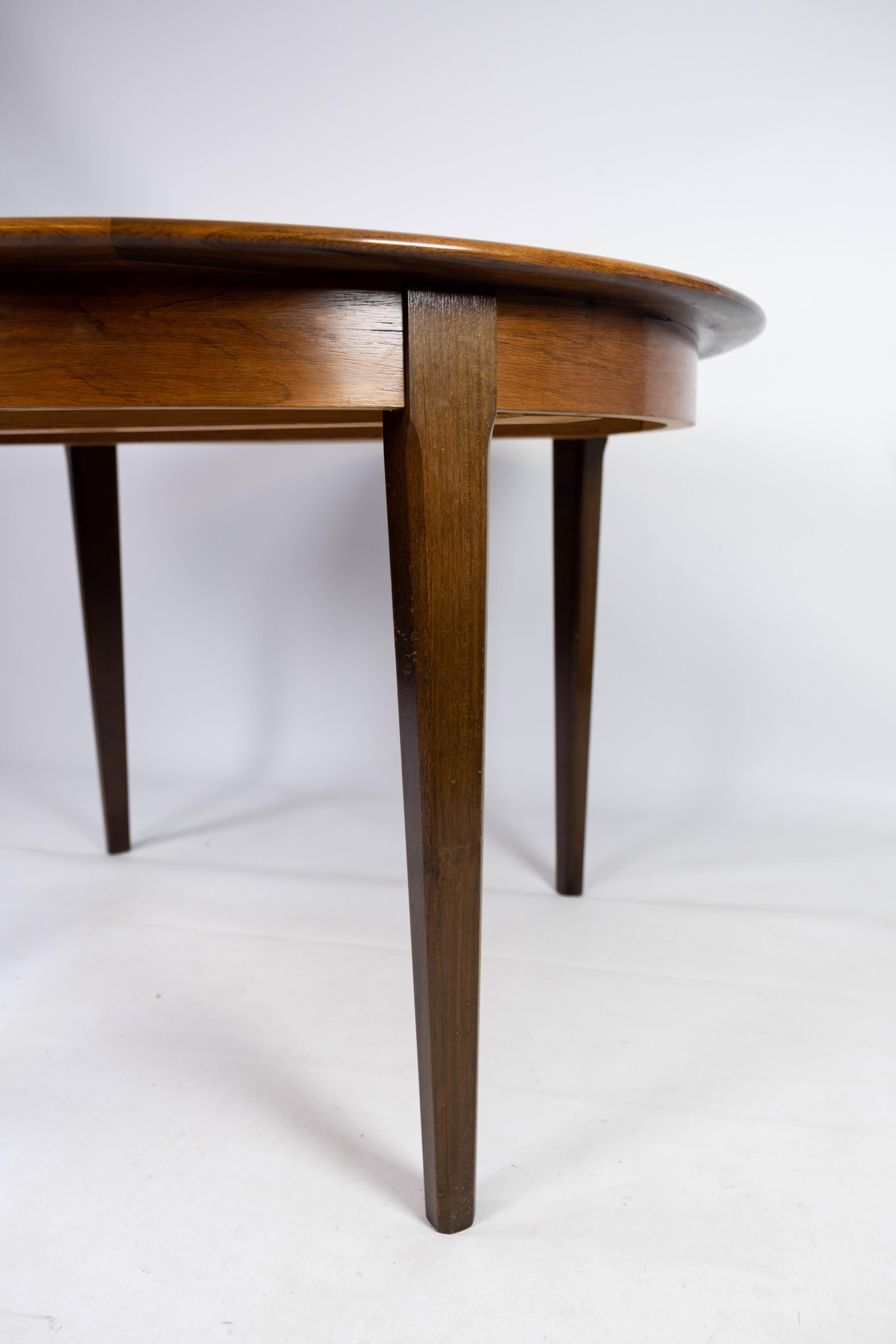 Mid-Century Modern Table de salle à manger fabriquée en bois de rose avec assiettes à rallonge, design danois des années 1960 en vente