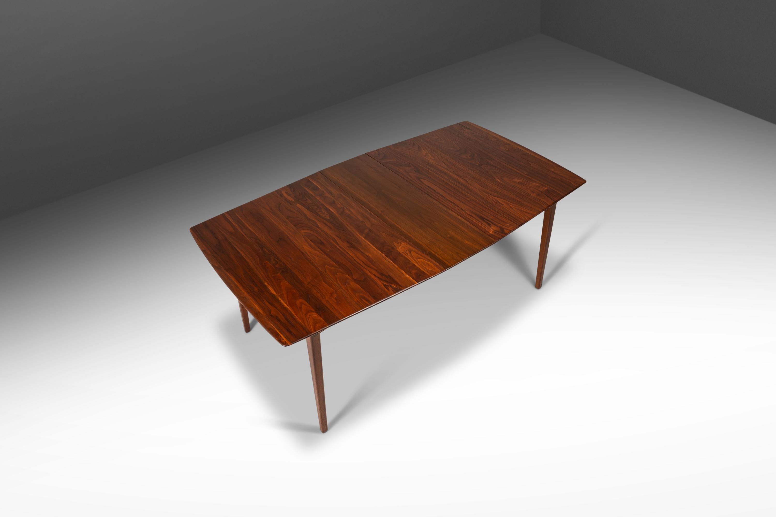 Fully restored and ultra rare this exceptional dining table, designed by the influential Russel Wright, is a true American gem. Famous for his table-centered approach to design, which came from his belief that the dining table was the true center of