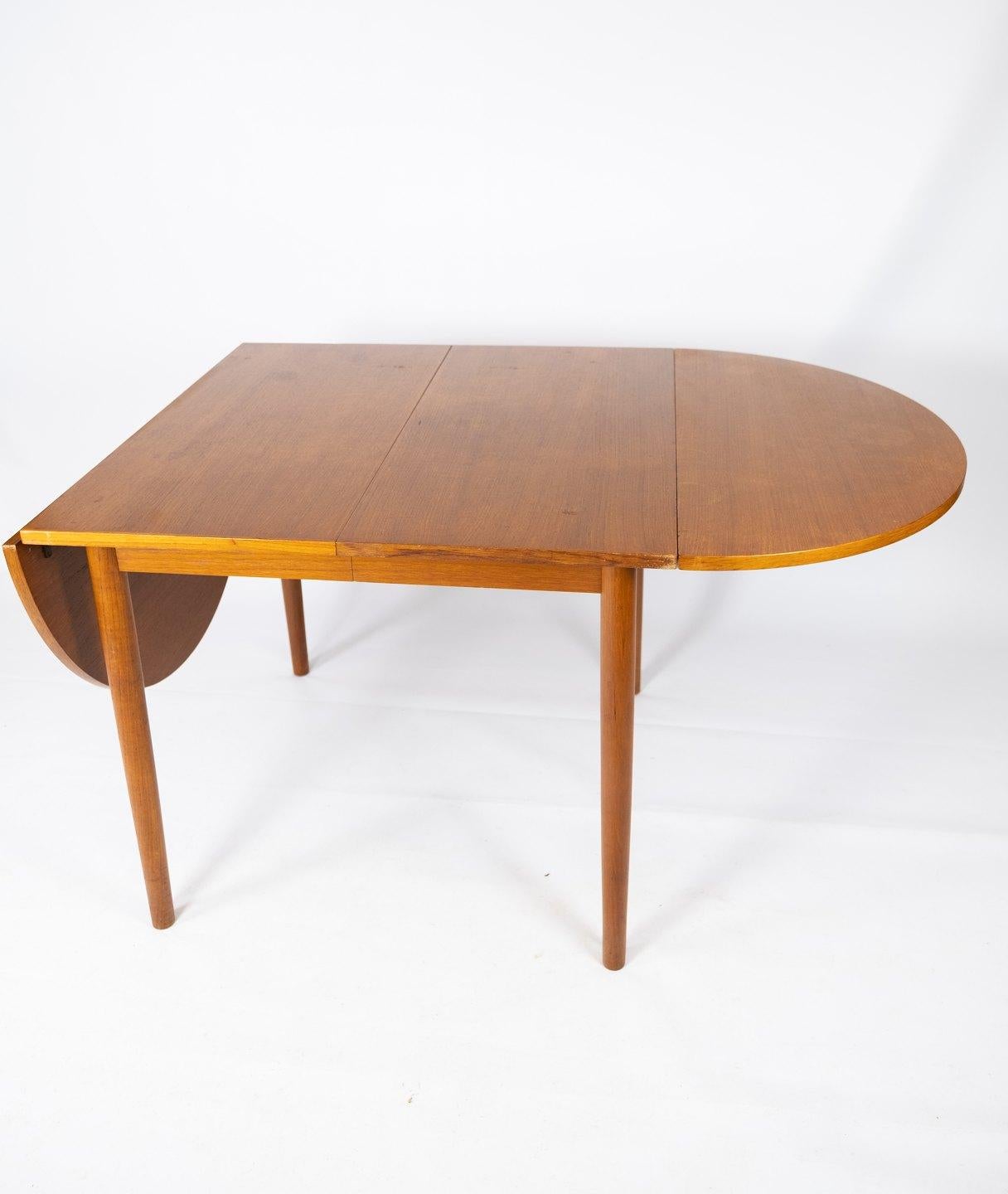 This teak dining table, designed by the renowned Danish furniture designer Arne Vodder in the 1960s, epitomizes the timeless elegance and functionality of Scandinavian design.

Crafted from high-quality teak wood, prized for its durability and