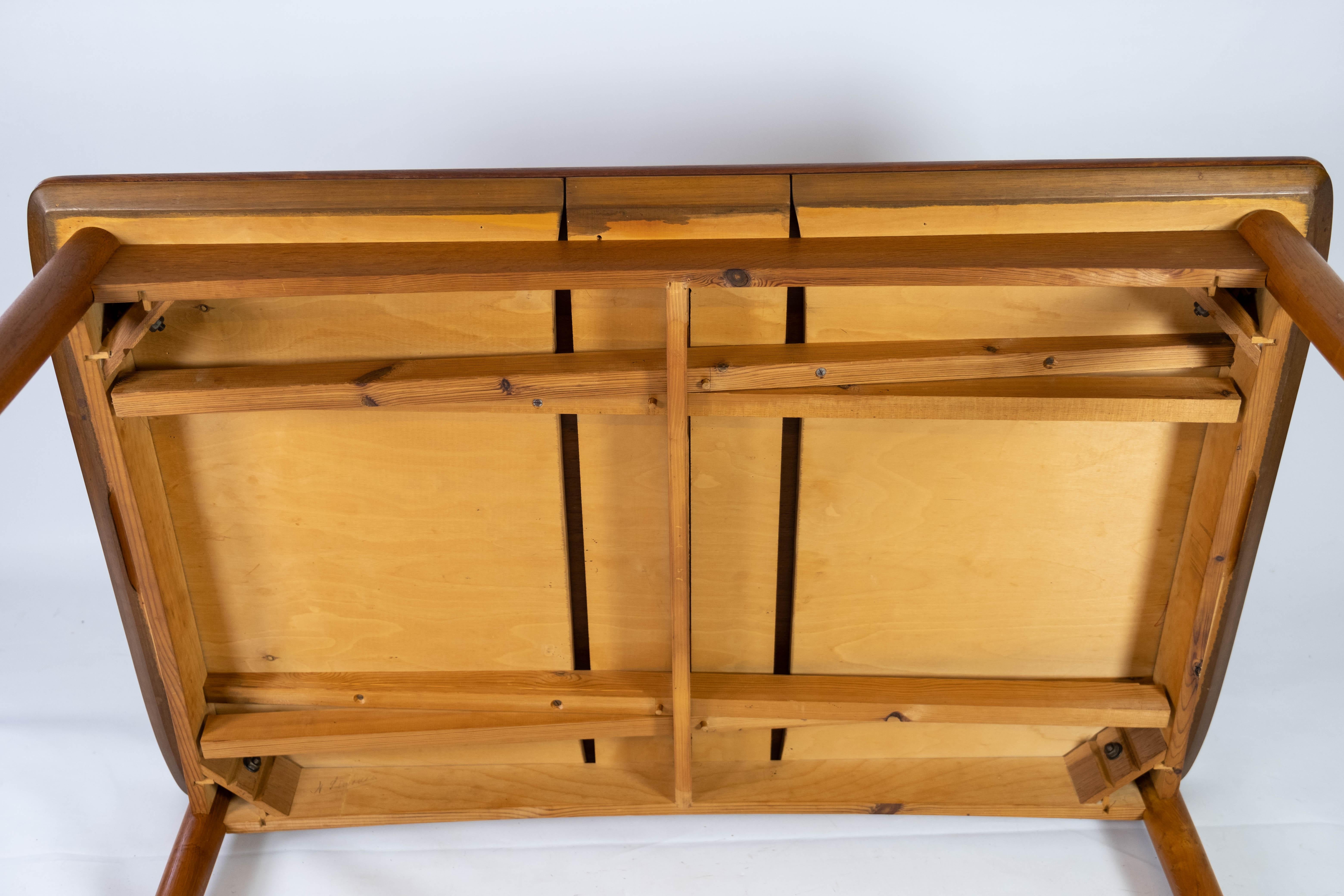 Table de salle à manger en teck avec rallonges et pieds en Oak des années 1960 en vente 11