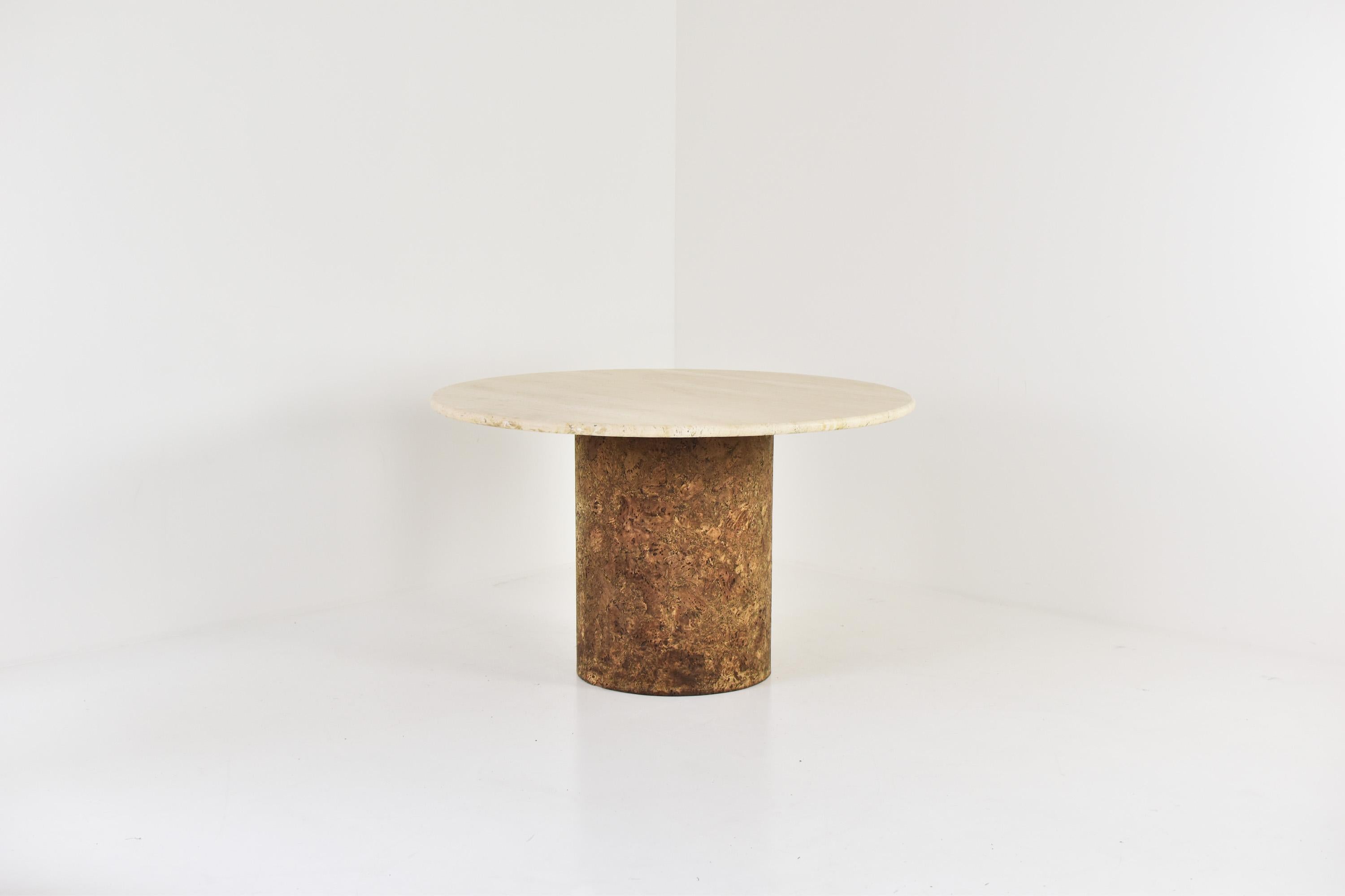 Interesting dining table in travertine and cork from the 1960’s. This table features a travertine top and the base is made out of cork. The table is in a beautiful and original condition and has no chips or cracks.