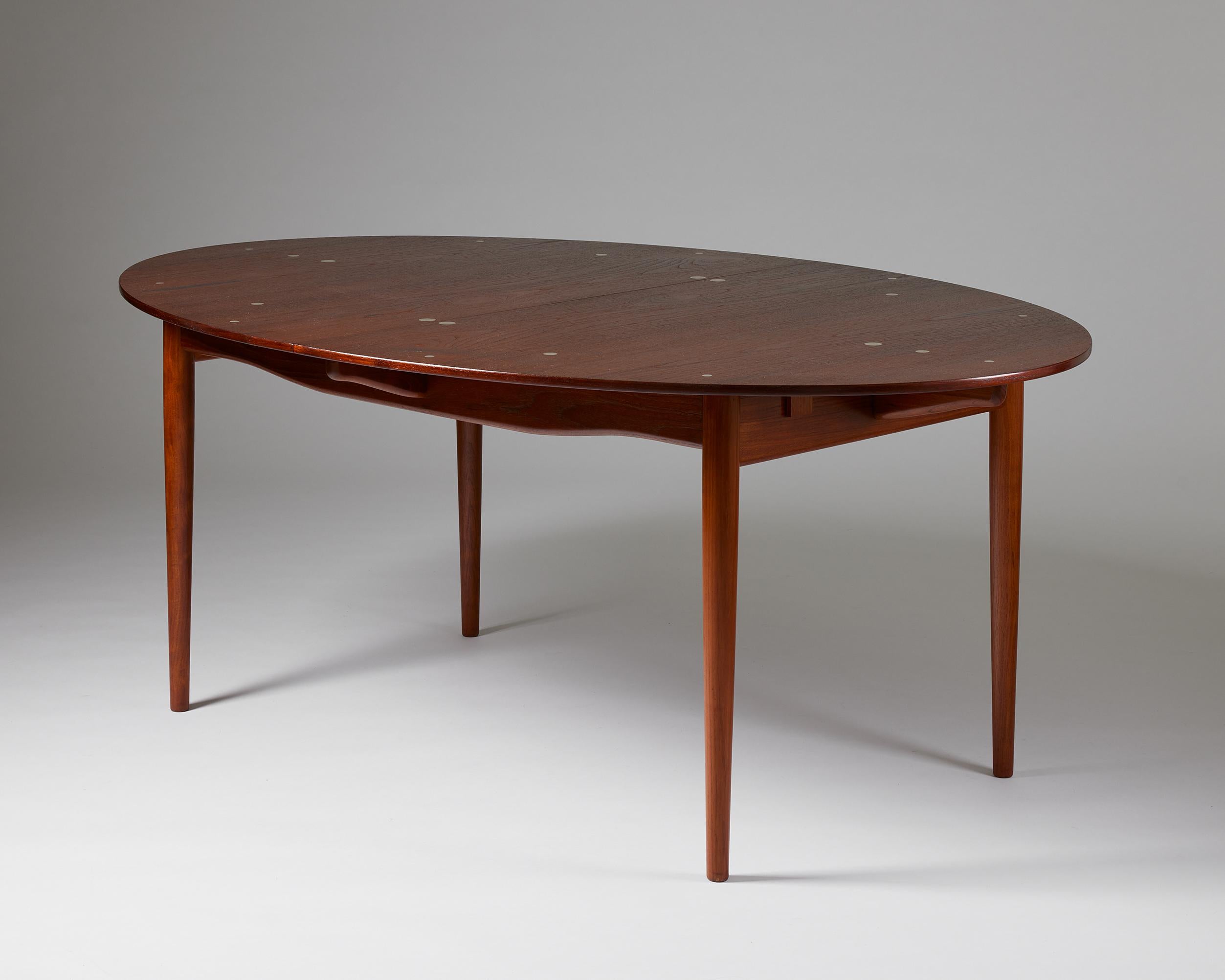 Dining table ‘Judas’ with extensions designed by Finn Juhl for Niels Vodder,
Denmark, 1948.

Teak and circular silver inlays.

Stamped.

Provenance: From a private Danish collection.

The 'Judas' table deserves to be seen as the embodiment of