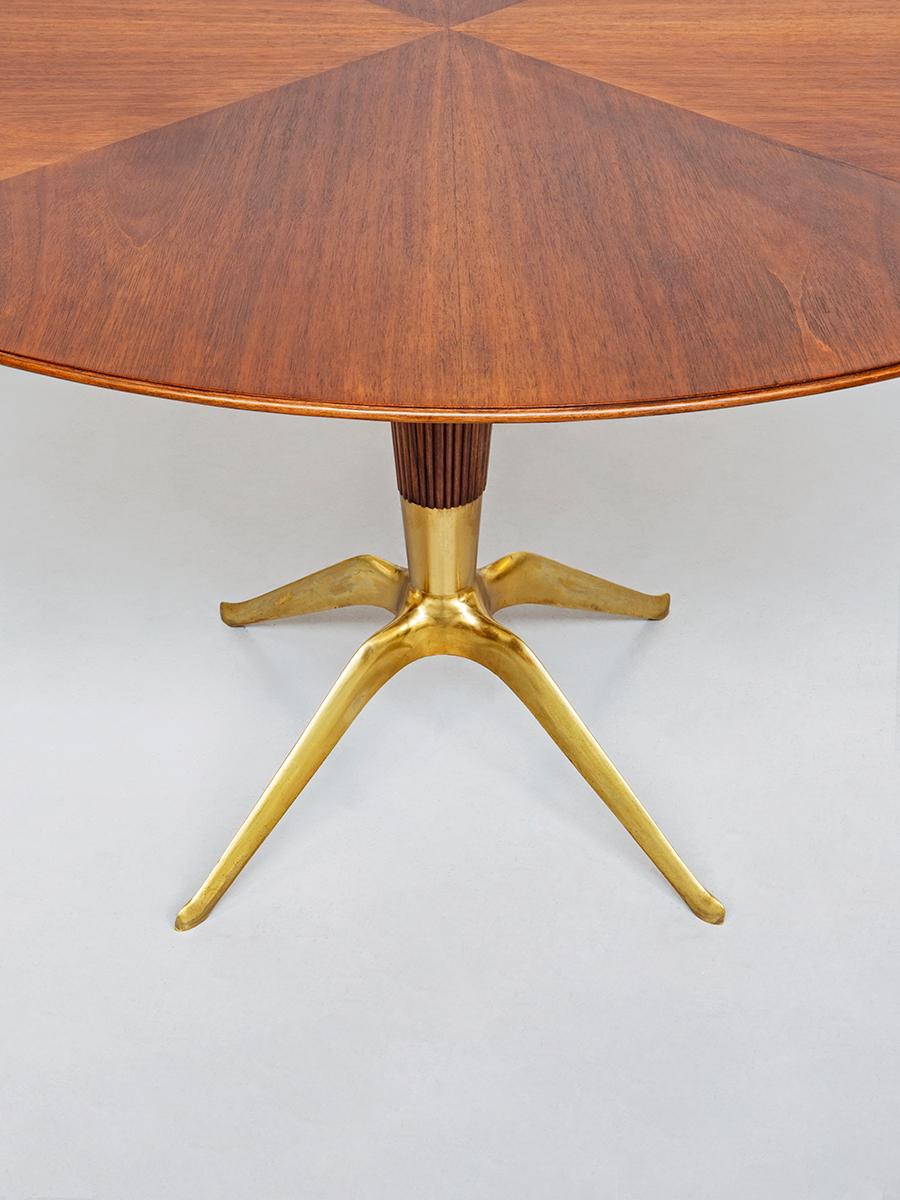 Dining table, a unique piece designed by Melchiorre Bega for the house of Dr. Pietro Caliceti in Bologna, 1948, Italy.
Structure in Italian walnut with round top. The central part of the basement is made with a high technique wood manufacture and