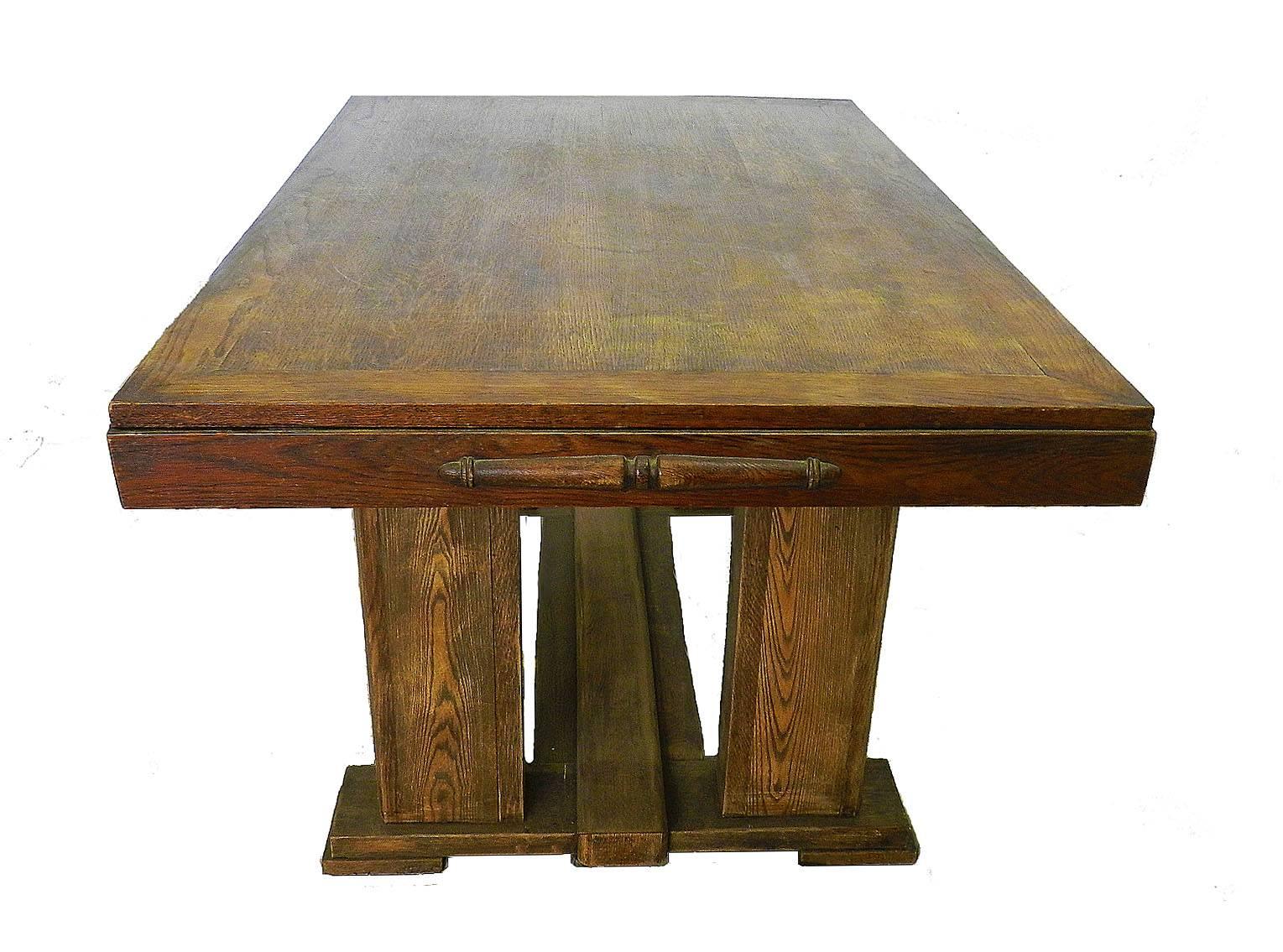French Dining Table Mid Century Extendable Oak French circa 1950 
This will take 2 plain wood leaves either end which we can supply please ask if required 
Each leaf will add 30cms 11.8ins
Monumental legs
Good original vintage condition with some