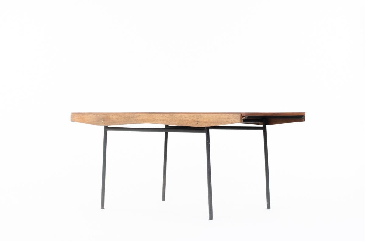 Dining table designed by the famous french designer Alain Richard and edited by Meuble TV in 1955 
Model 324
Composed of a black metal base, top in veneer teak and side panels in solid teak assembled with nice brass screws.