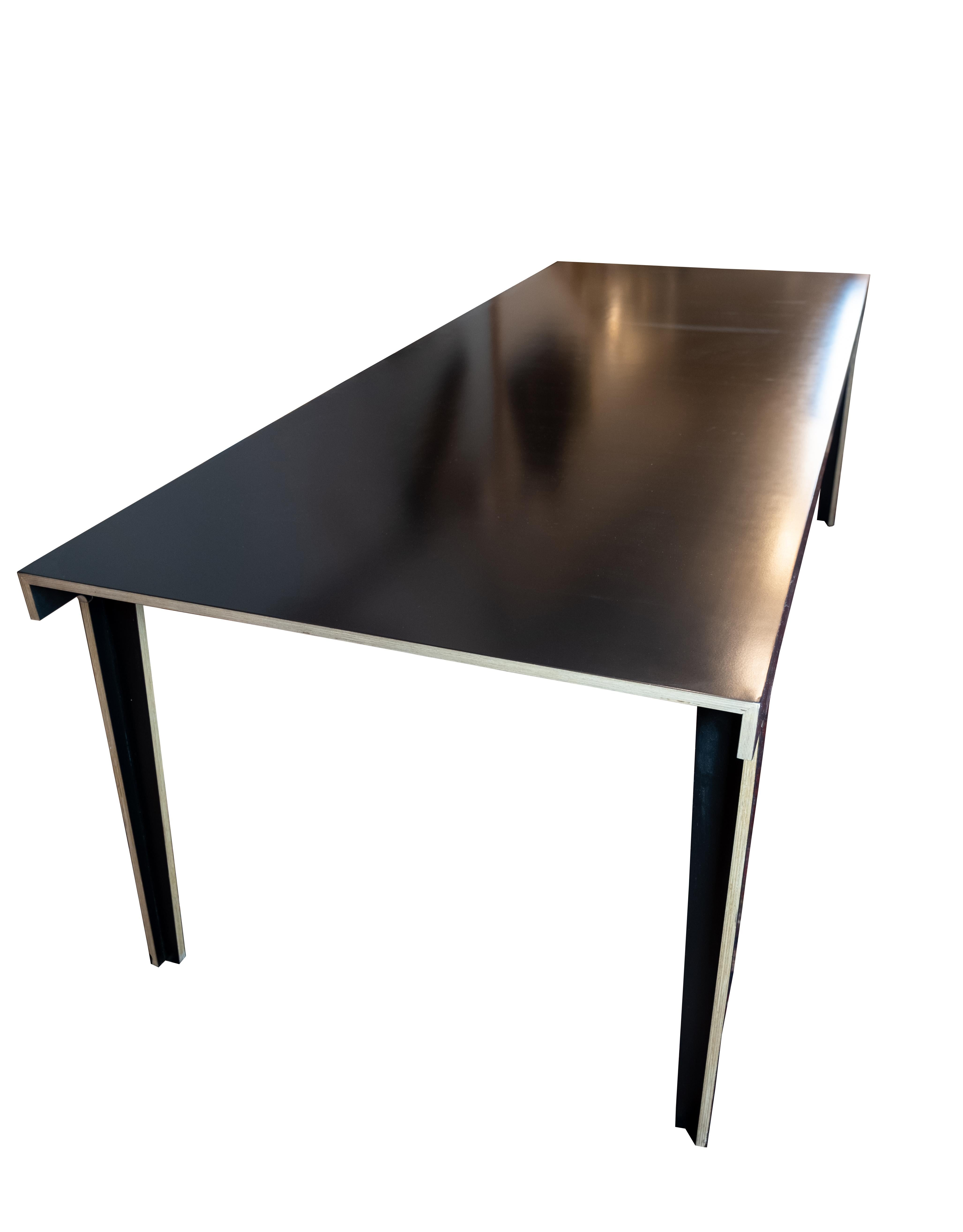 The Dining Table, model M5, embodies the contemporary elegance and innovative design associated with Established & Sons, a prominent design company known for pushing the boundaries of creativity and craftsmanship.

Designed by Frank in 2006, this
