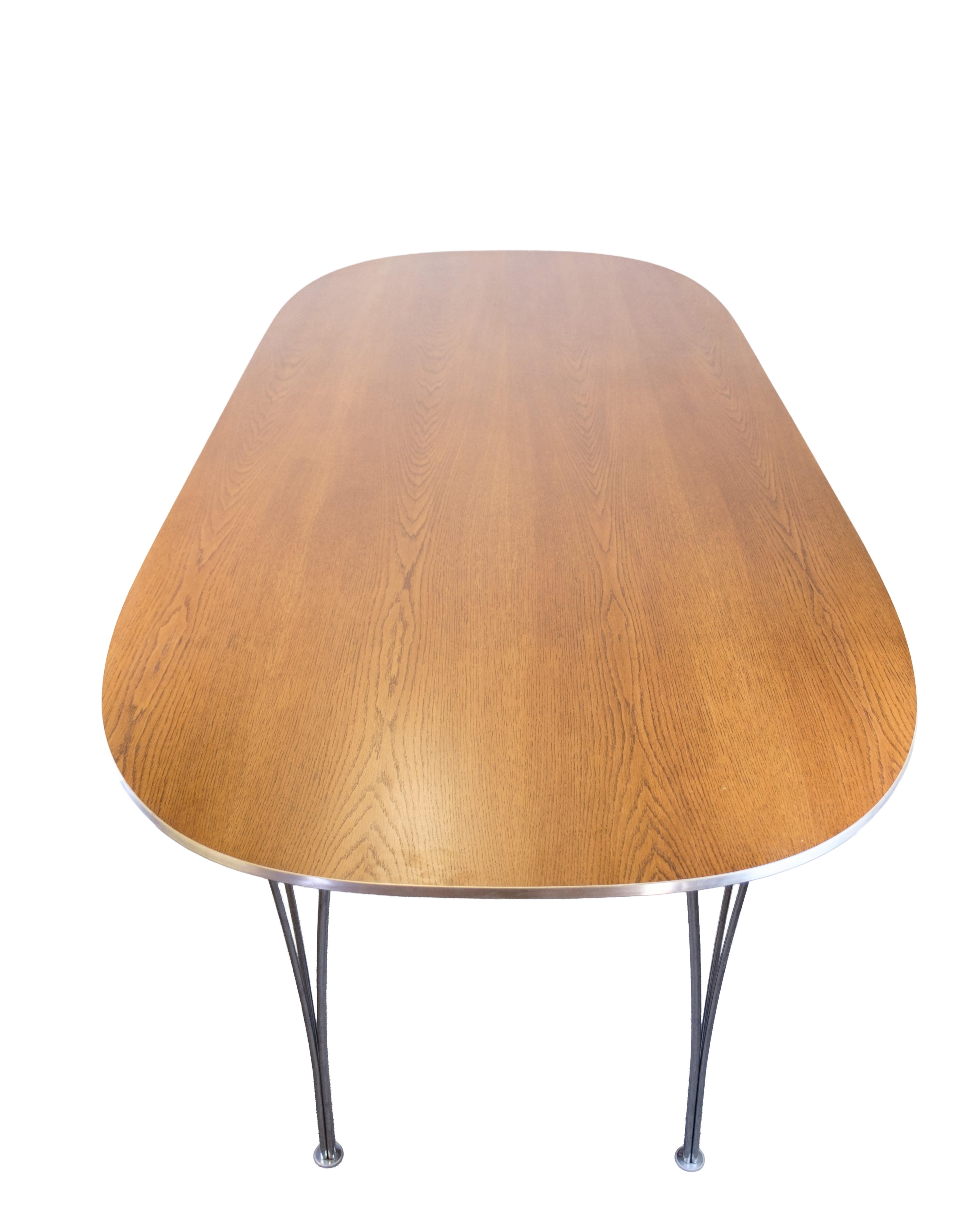 Mesa de comedor Modelo Superellipse En Roble Y Con Borde De Aluminio Por Bruno Mathsson mediados del siglo XX en venta