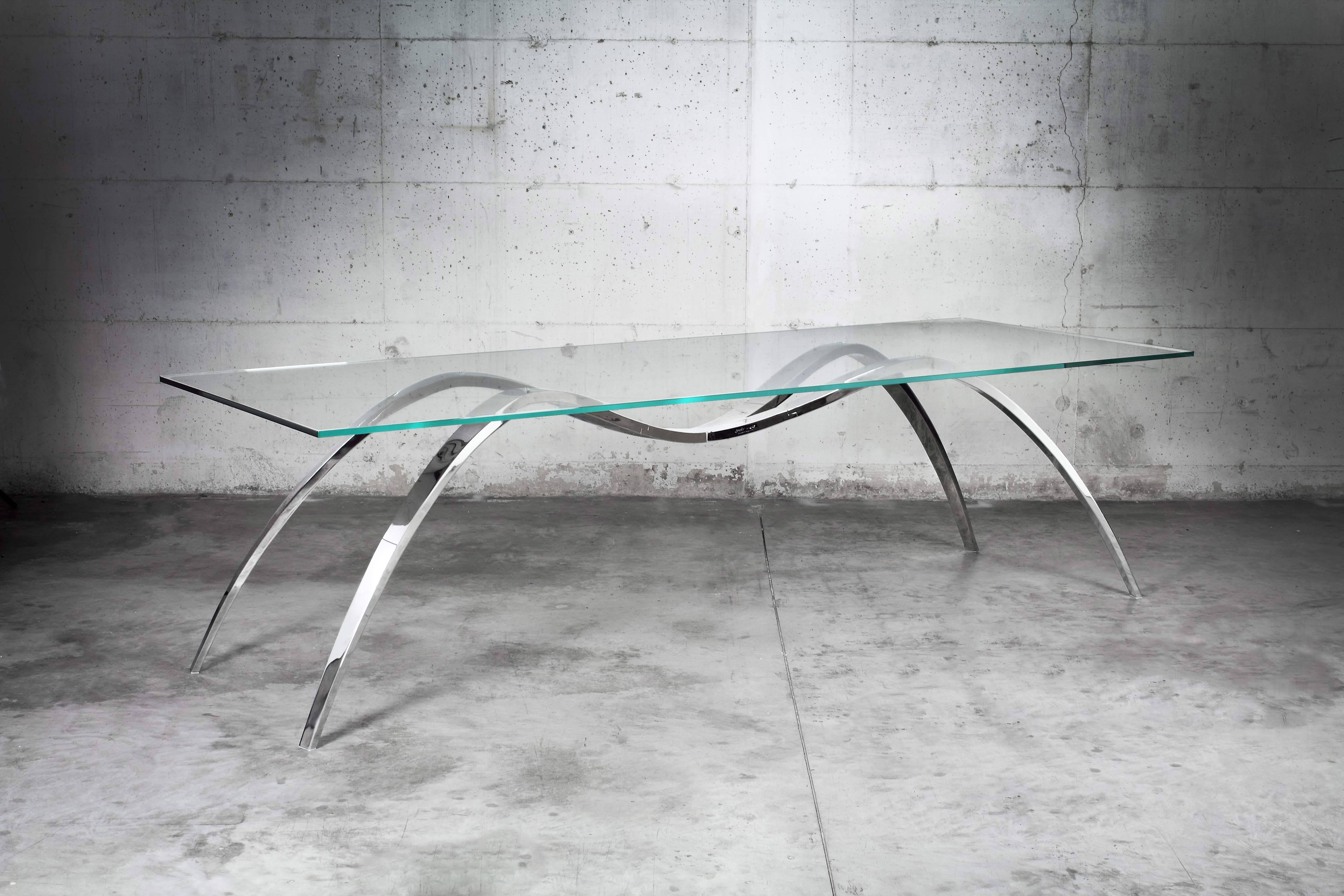 The 'Spider' dining table is made of mirror polished stainless steel and table top in extra-clear crystal glass. 

Dining table dimension: L 270 x W 100 x H 75 cm. Dimensions are customizable.

Limited Edition of 15.

Each table is hand signed and