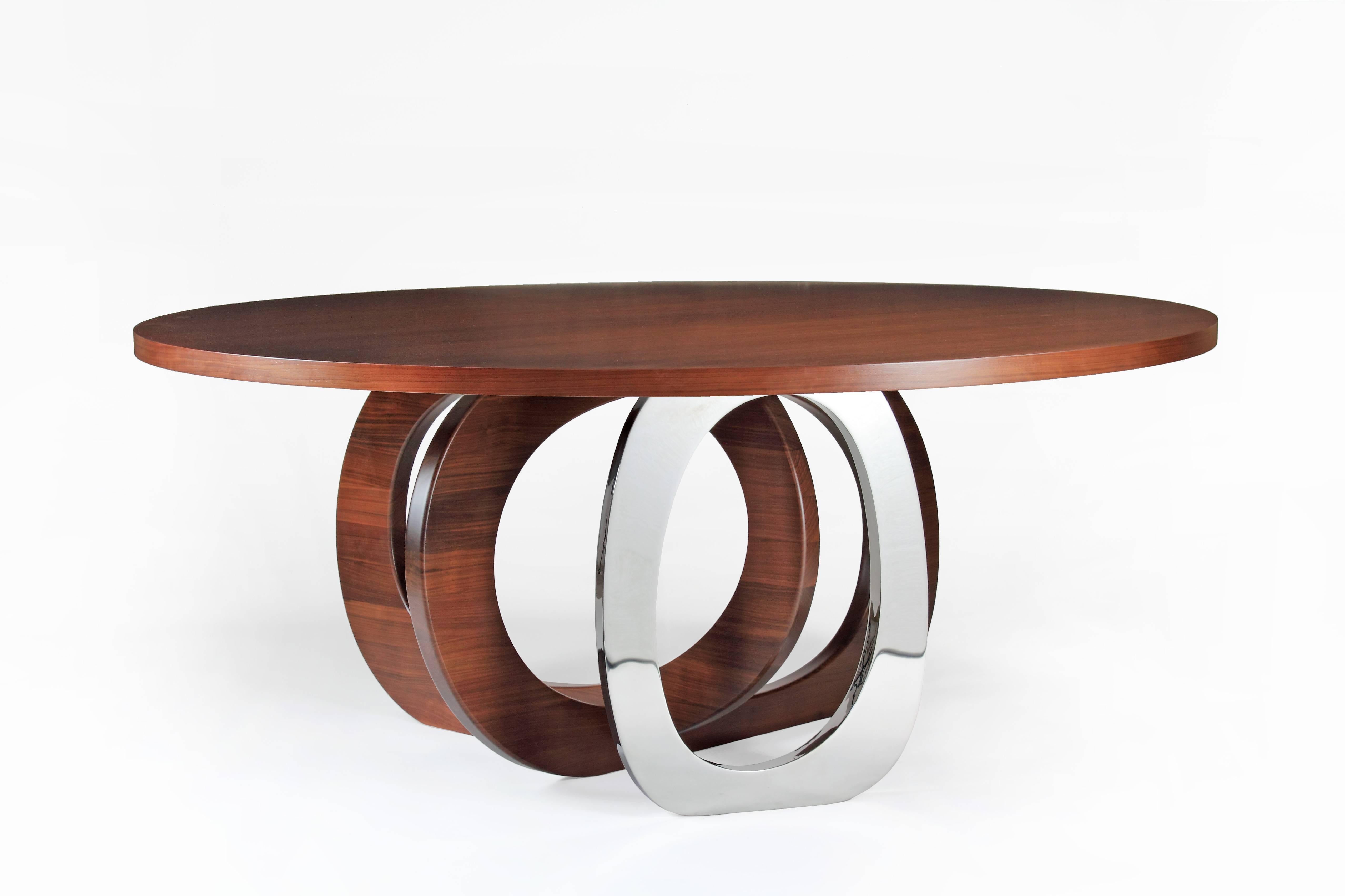 The 'Bangles Kelowna' table has a circular top, two rings in solid walnut wood and a single ring in mirror polished stainless steel. 

Dimensions: D 180 x H 75 cm. Dimensions are customizable.

Each table is hand signed and numbered by the artists