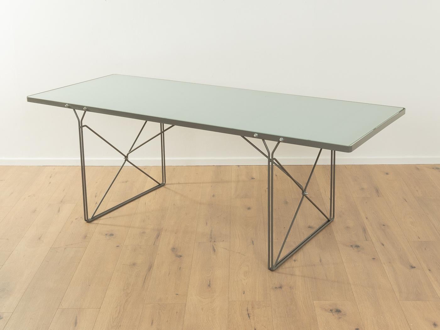 Dining table MOMENT by Niels Gammelgaard for IKEA from the 1980s. Powder-coated metal frame in matt grey with a frosted glass top.

Quality Features:

    very good workmanship 
    high quality materials
    Made in Sweden, Design: Niels