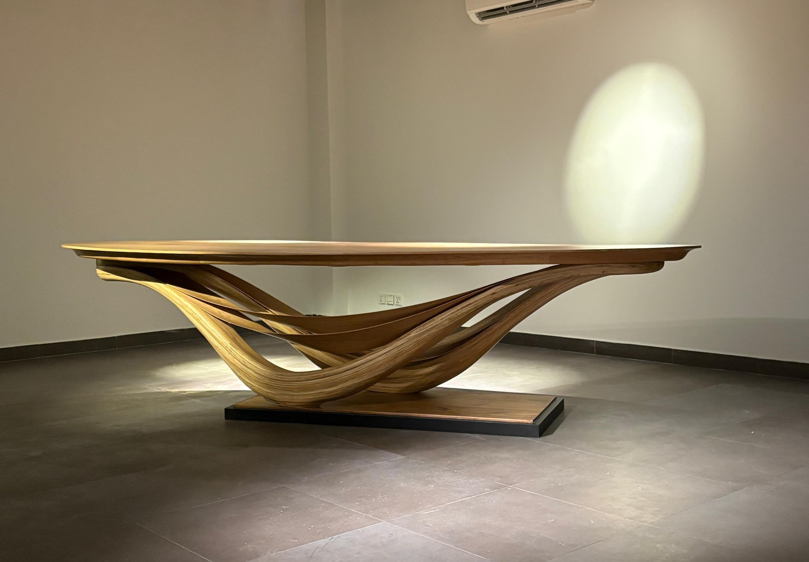 The Dining Table No. 3 of the Fluentem Series is a piece where the makers have focused on detailed elements of the minimally designed piece; balancing on two points.

The Studio has taken its exploration of wood further with the Fluentum Series.