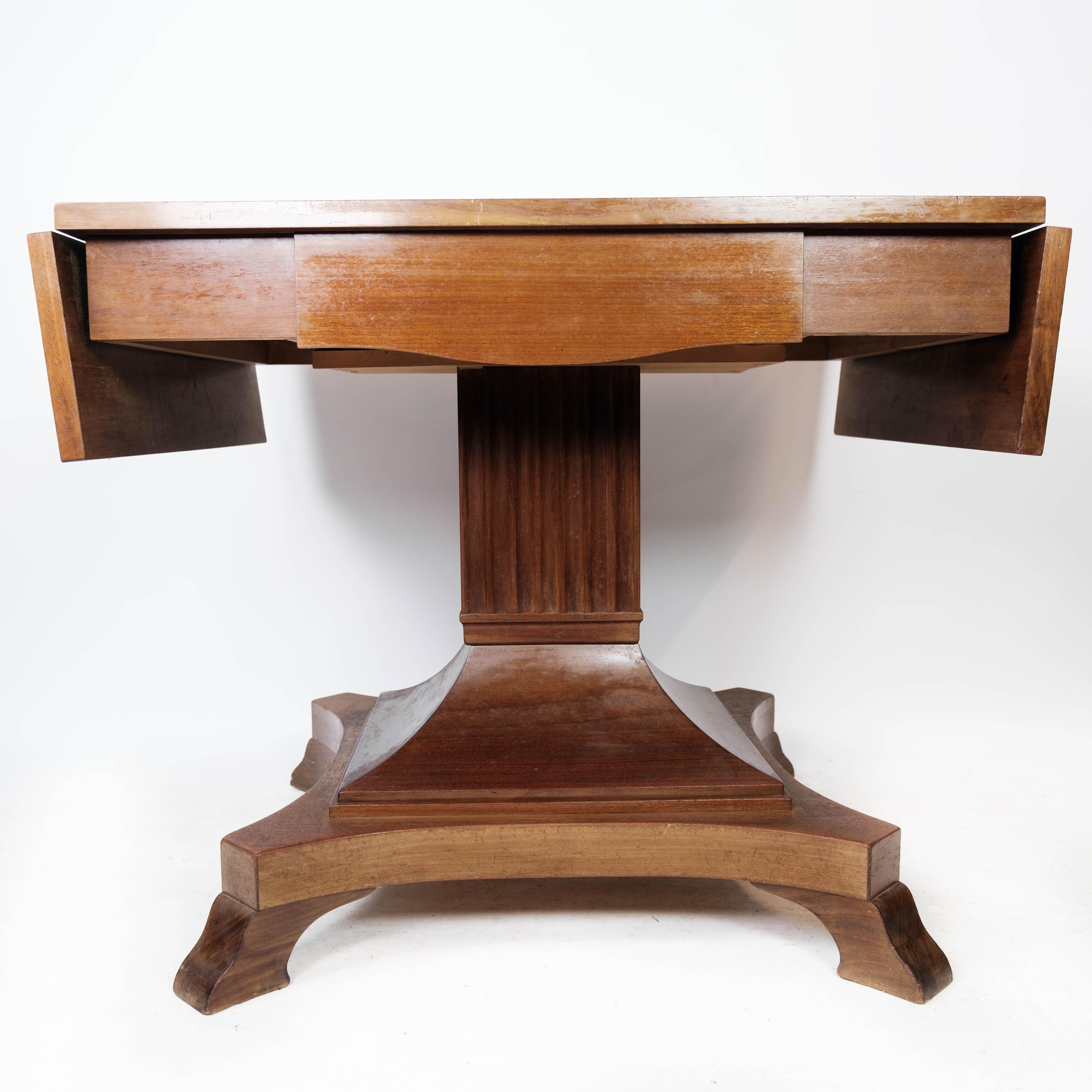 
The mahogany dining table from the 1920s is a timeless piece of furniture that exudes elegance and sophistication. Crafted from high-quality mahogany wood, this table boasts a rich and luxurious appearance that adds a touch of classic charm to any