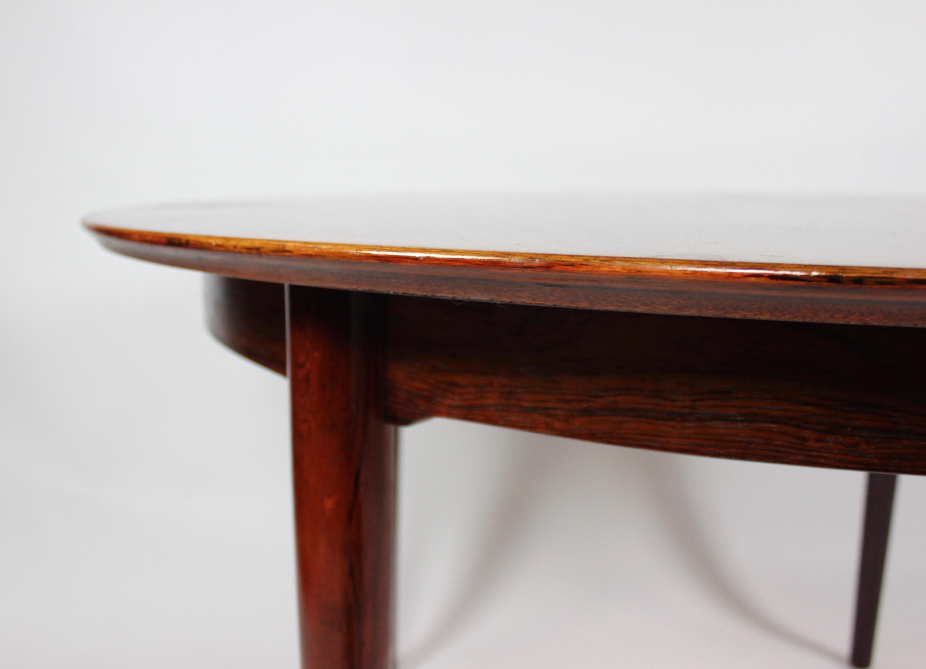 Danish Dining Table of Rosewood with Three Extension Plates by Arne Vodder, 1960s For Sale