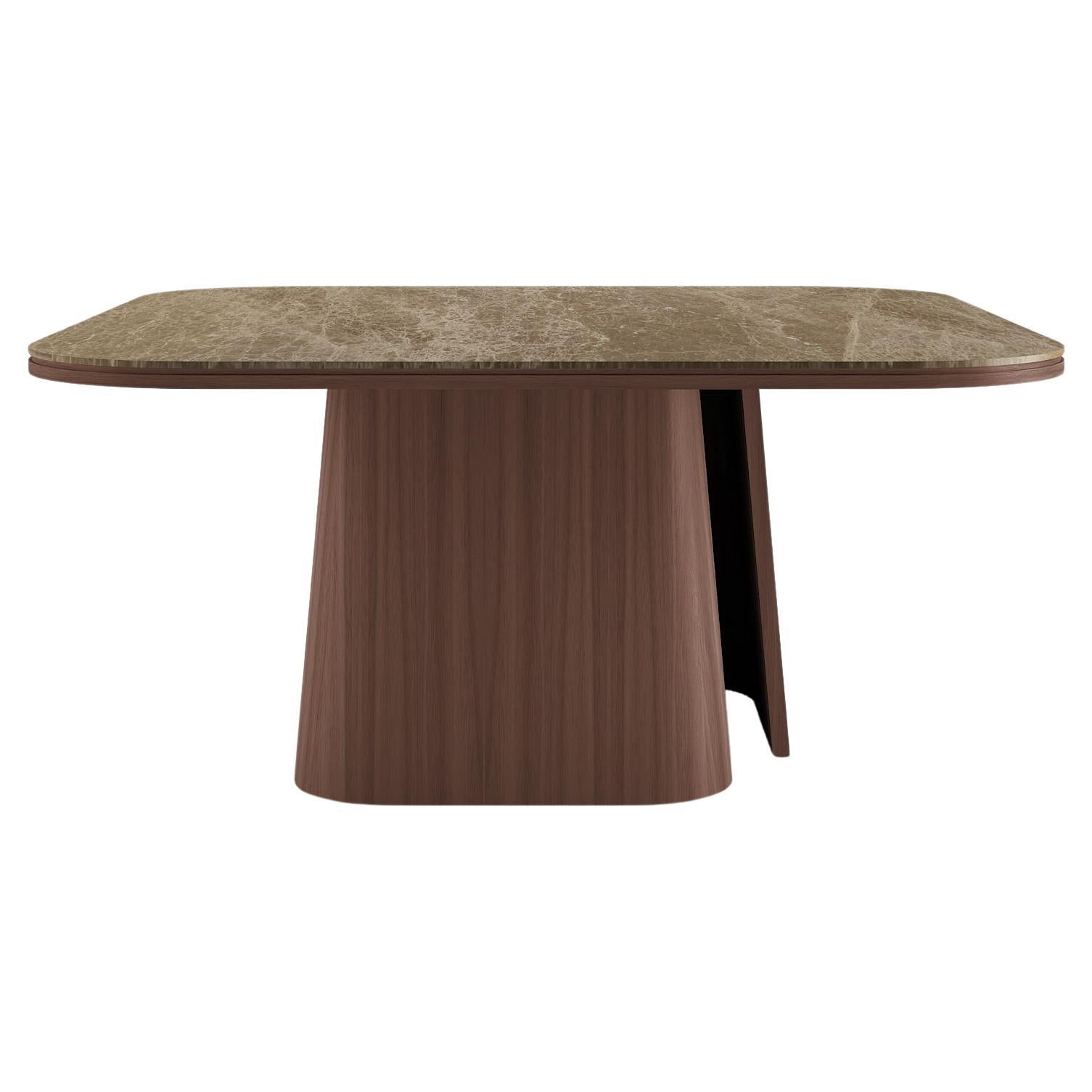 Mesa de comedor con patas de nogal americano y tablero de mármol negro Sahara.

La mesa OOMA no es sólo un mueble, sino una sensación de pureza inmediata, que ofrece una ruptura con el caos del mundo para crear orden, espacio y líneas limpias.