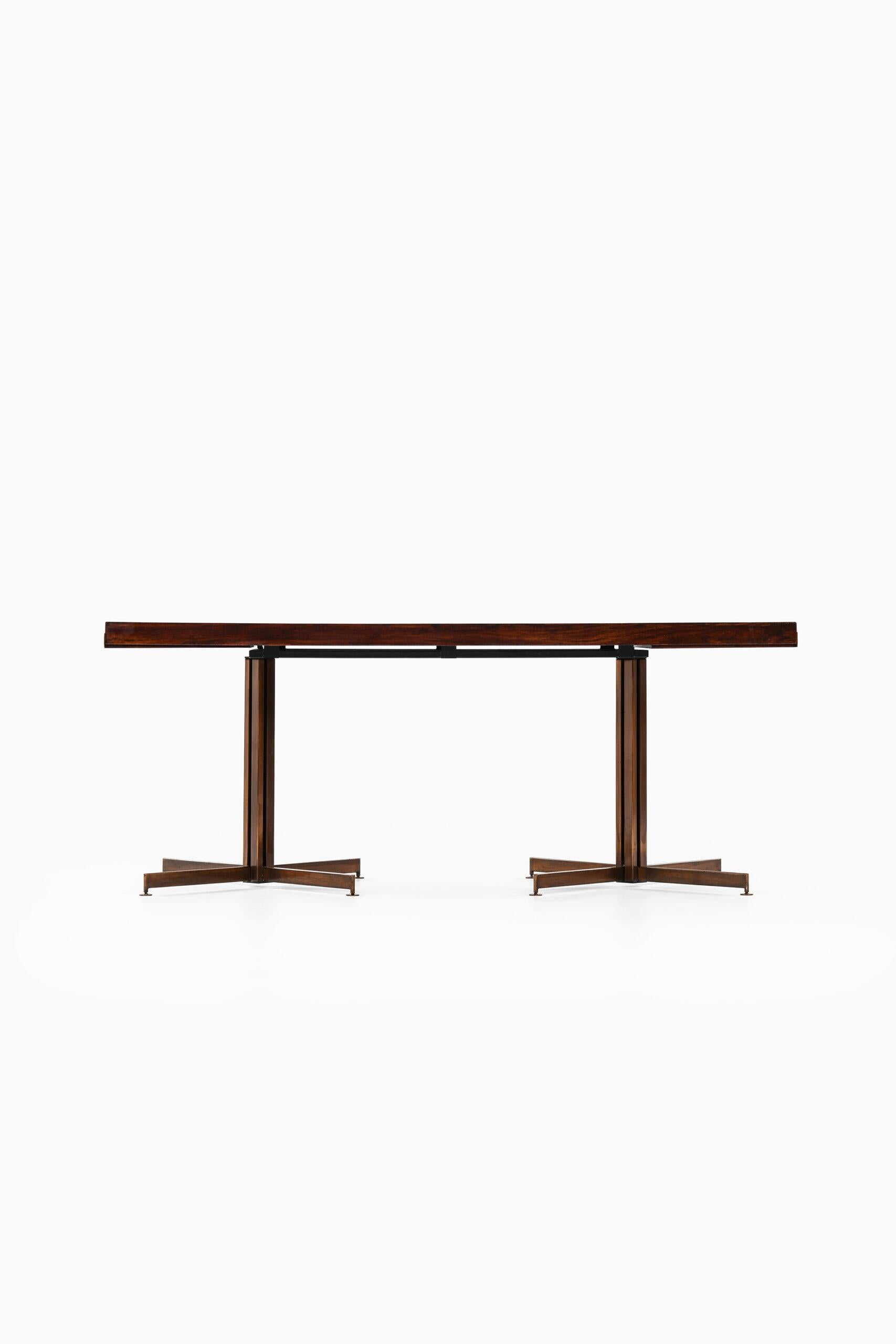Rare dining table by unknown designer. Produced in Italy.
Dimensions (W x D x H): 180,5 ( 256 ) x 84 x 72 cm.