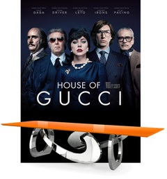 Tavolo da pranzo scultoreo con base in acciaio a specchio oro 24 Kt e piano in marmo nero Marquina