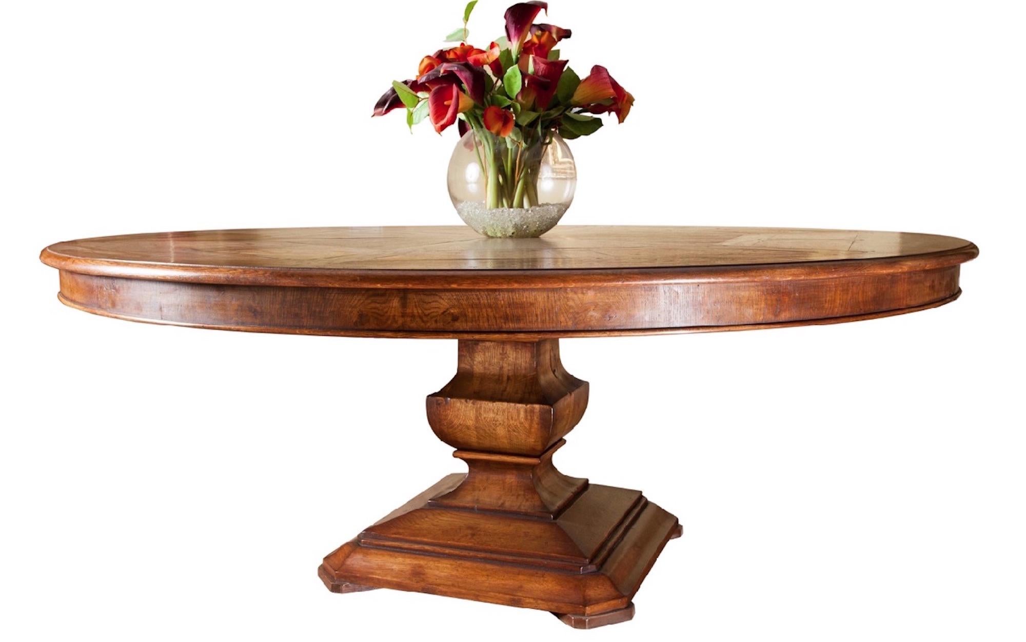 Fabulous Handmade circular dining table, superb quality (made in the UK). 
The hexagonal segmented oak and burr oak panelled top sits on a contemporary platform column base. Seats 8/10. 
Table shown : Semi Rustic finish & Antique Straw Colour gives