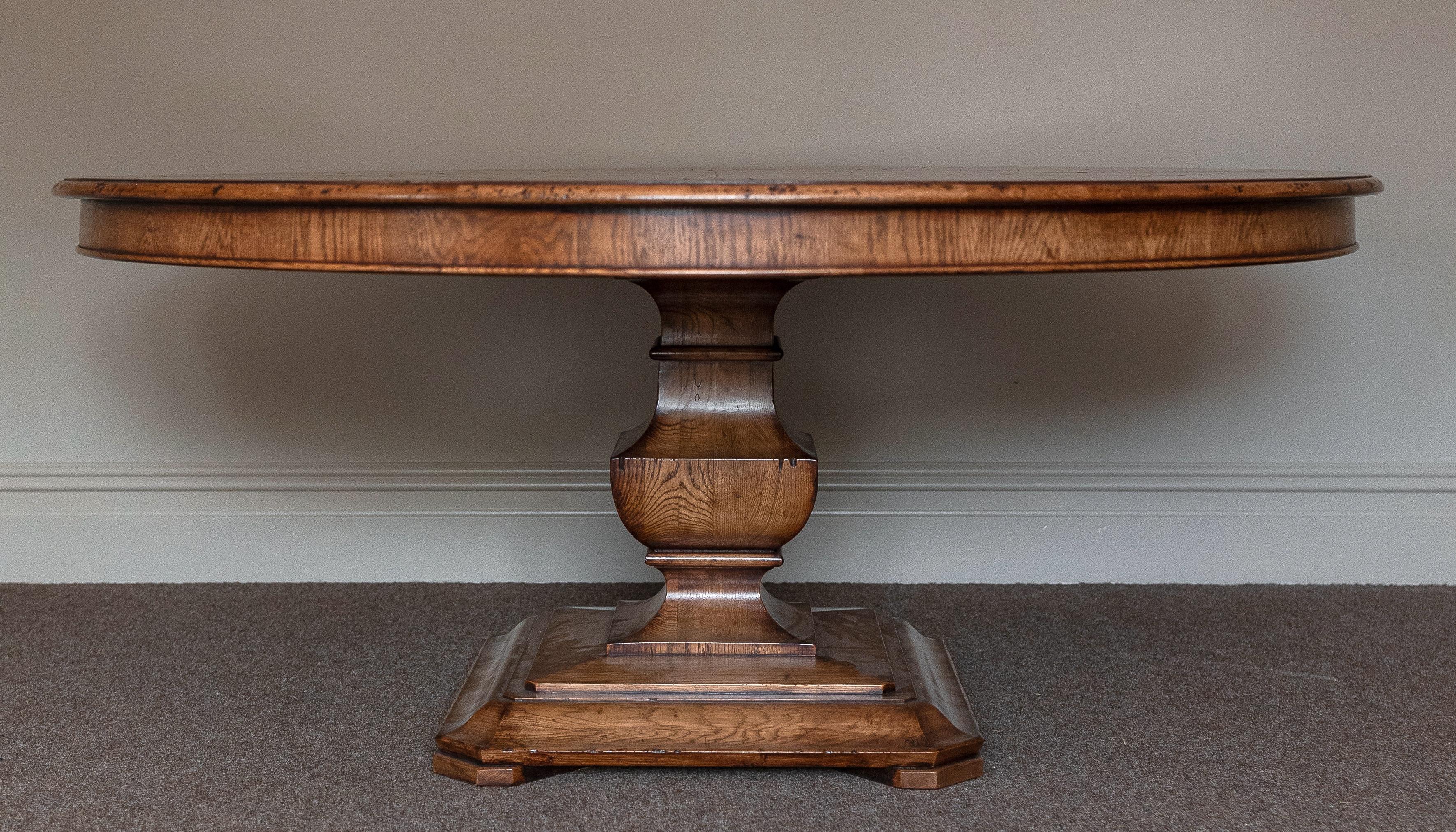 Fabulous Handmade circular dining table, superb quality (made in the UK). 
The hexagonal segmented oak and burr oak panelled top sits on a contemporary platform column base. Seats 8/10. 
Table shown : Semi Rustic finish & Antique Straw Colour gives