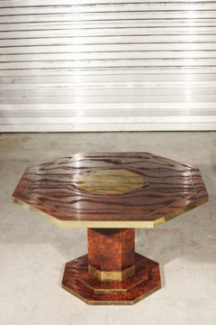 Dining table signed by Jean Claude Mahey in lacquered elm burl and brass