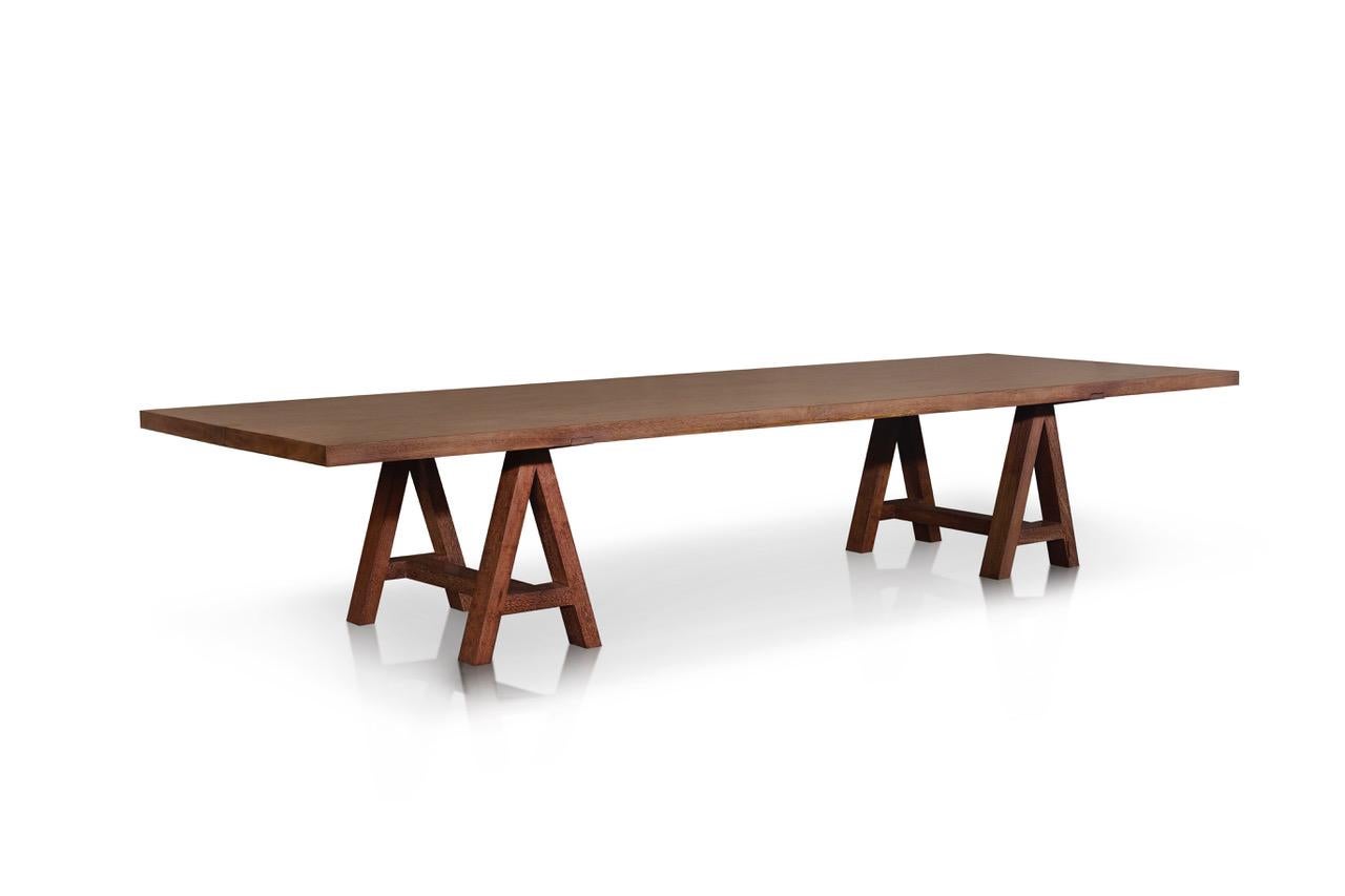 This unique piece table designed by Jerome Abel Seguin is inspired by workshop tables.

The top is an open book made by two planks of merbau wood.
This is table can be dismantled, with out any screw.

To promote exchange and conviviality, this