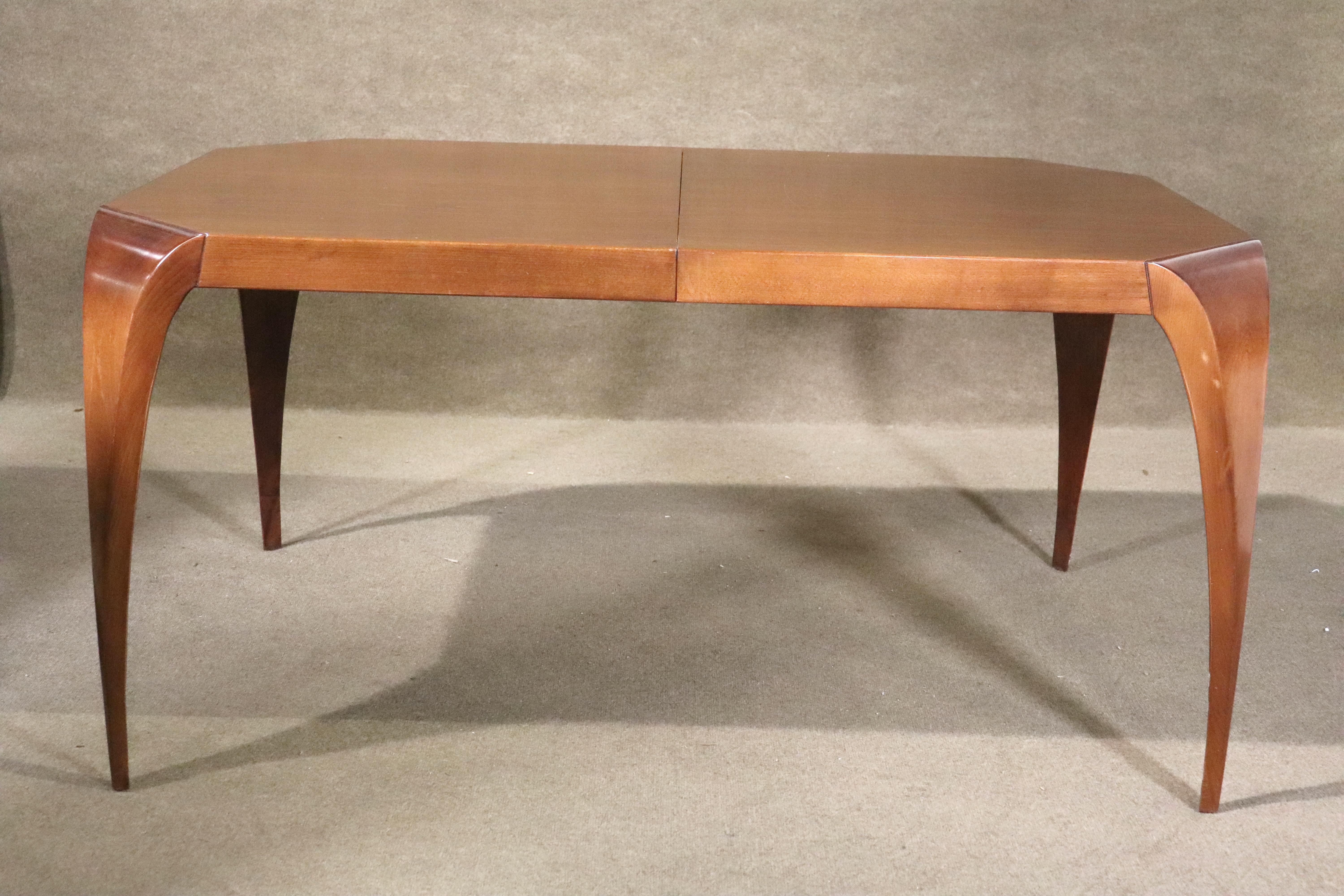 Five foot long dining table in a warm cherry wood color finish. Wild and exaggerated legs are the feature on this Art Deco style dining table.
Please confirm location NY or NJ