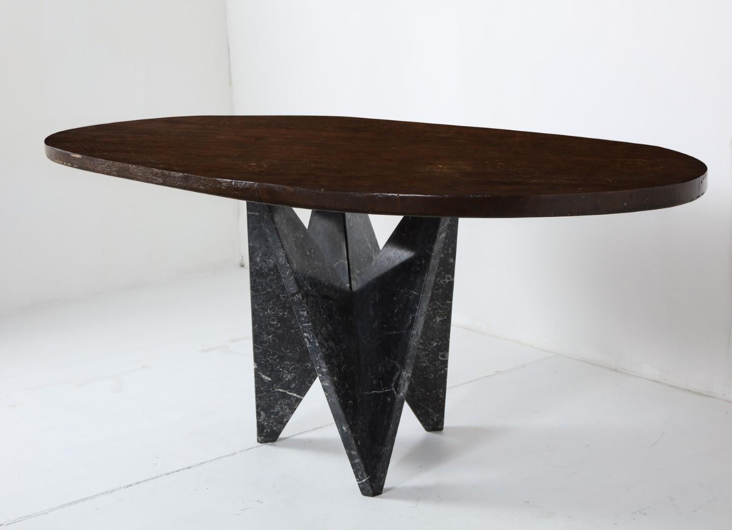 Dining table with 1980s Italian sculptural black marble base. 

Elliptical oval walnut top custom made by Dos Gallos (Los Angeles) in 2019. 

Table top is approx 1 5/8